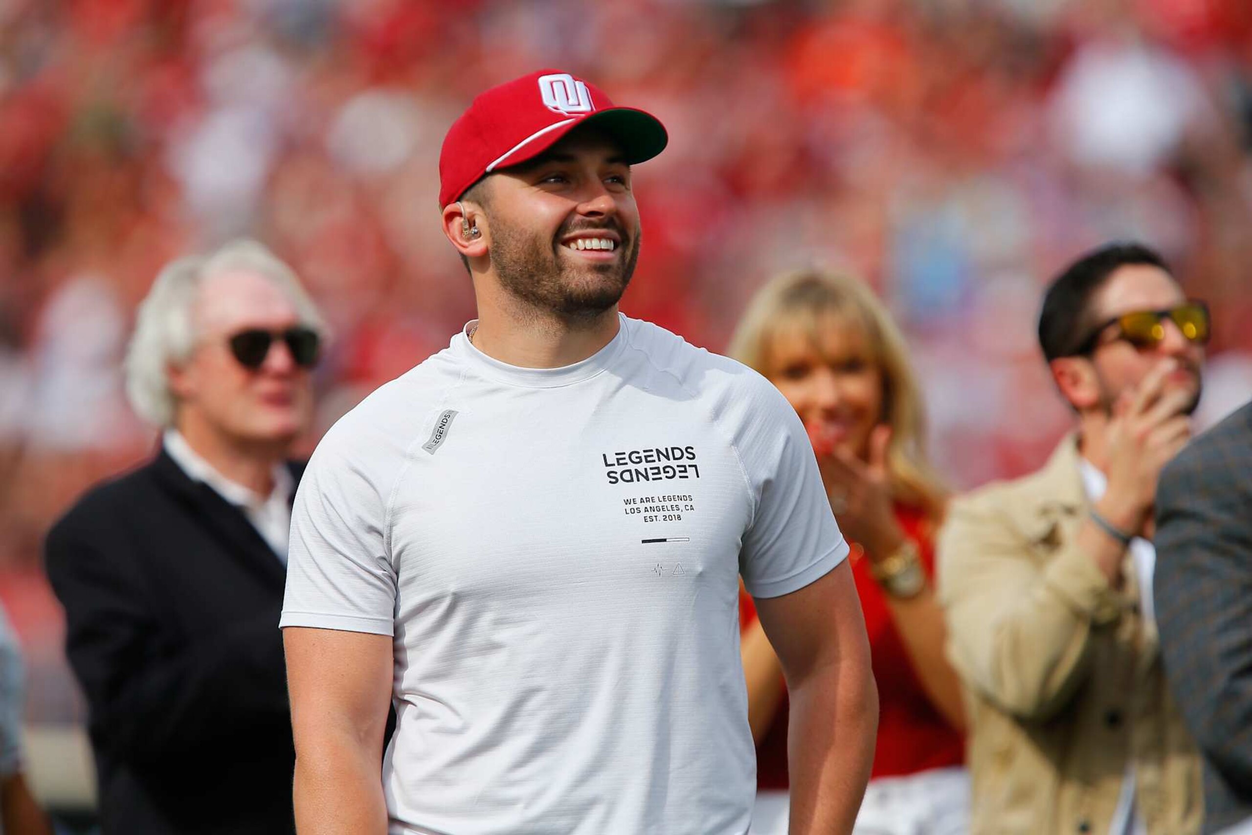 NORMAN, OK - APRIL 23:  Quarterback Baker Mayfield of the Oklahoma Sooners smiles as he is honored with the unveiling of a life-size statue of him during the spring game at Gaylord Family Oklahoma Memorial Stadium on April 23, 2022 in Norman, Oklahoma.   (Photo by Brian Bahr/Getty Images)