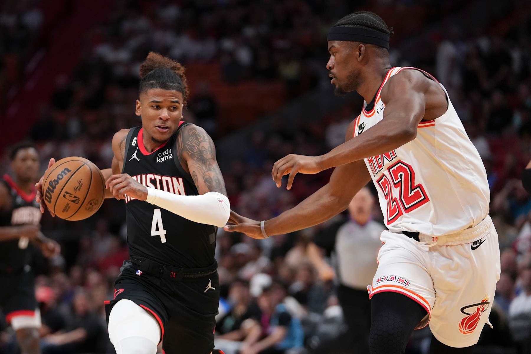 MIAMI, FLORIDA - FEBRUARY 10: Jalen Green #4 of the Houston Rockets drives to the basket while being defended by Jimmy Butler #22 of the Miami Heat during the first half at Miami-Dade Arena on February 10, 2023 in Miami, Florida. NOTE TO USER: User expressly acknowledges and agrees that,  by downloading and or using this photograph,  User is consenting to the terms and conditions of the Getty Images License Agreement. (Photo by Eric Espada/Getty Images)