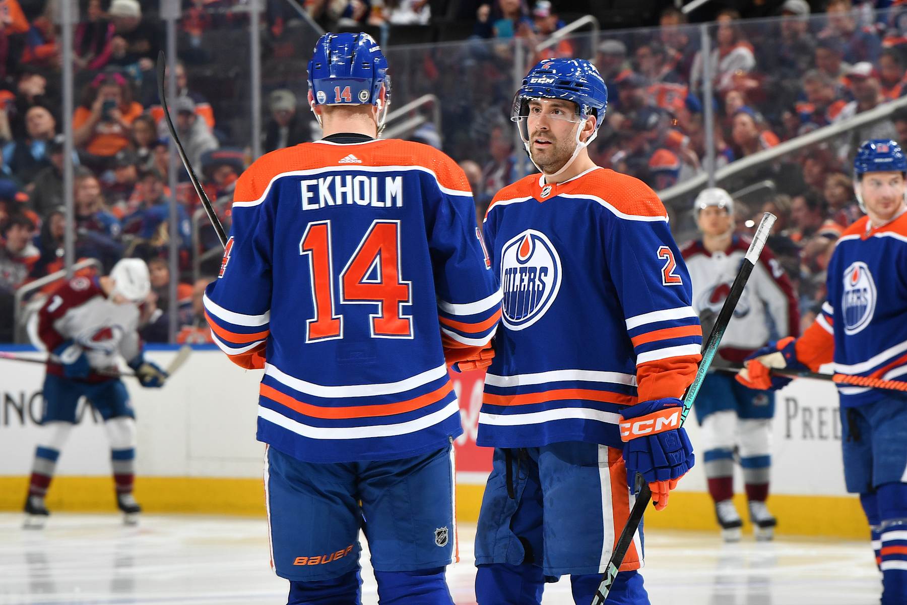 EDMONTON, CANADA - APRIL 5: Evan Bouchard #2 and Mattias Ekholm #14 of the Edmonton Oilers discuss the play during the game against the Colorado Avalanche at Rogers Place on April 5, 2024, in Edmonton, Alberta, Canada. (Photo by Andy Devlin/NHLI via Getty Images)