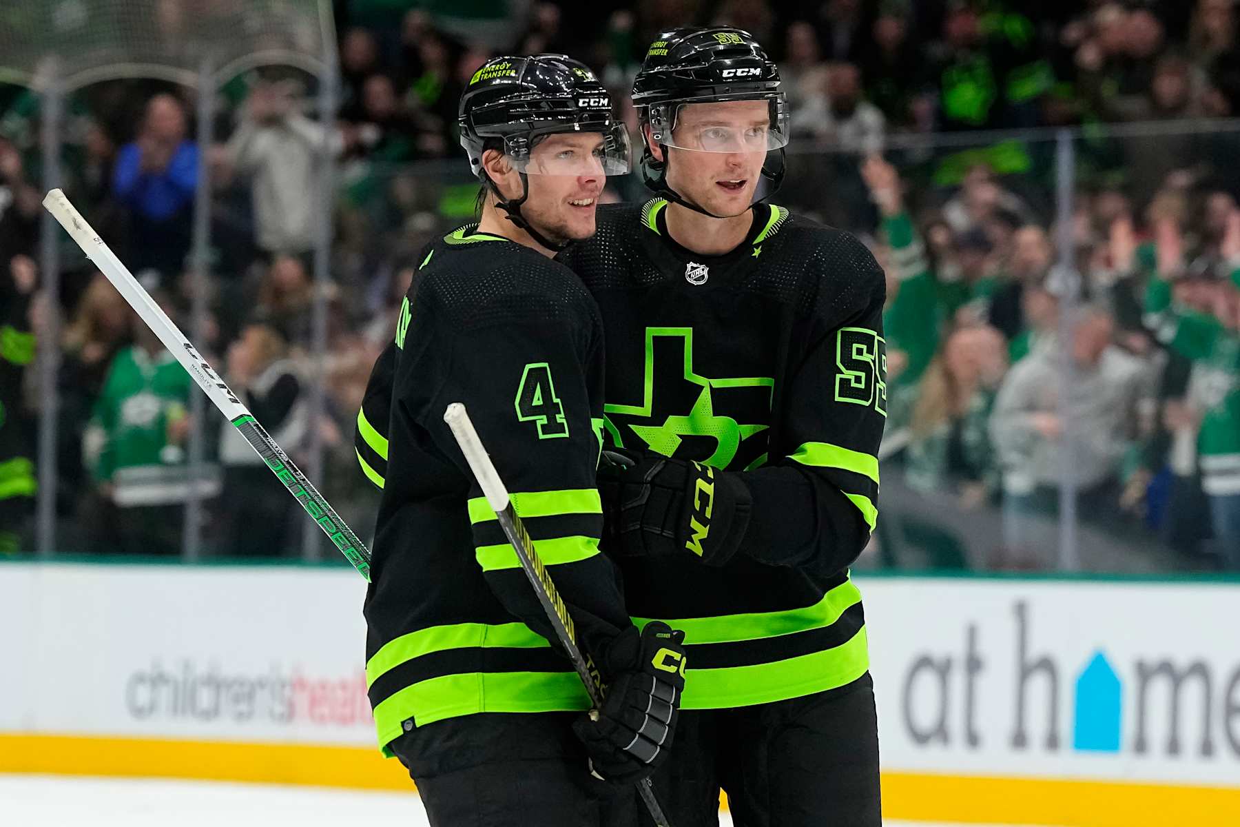 DALLAS, TEXAS - JANUARY 27: Thomas Harley #55 of the Dallas Stars is congratulated by Miro Heiskanen #4 after Harley's first period goal against the Washington Capitals at American Airlines Center on January 27, 2024 in Dallas, Texas. (Photo by Sam Hodde/Getty Images)