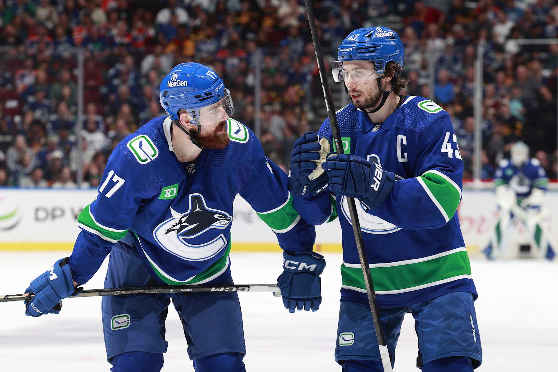 VANCOUVER, CANADA - MAY 10: Quinn Hughes #43 of the Vancouver Canucks talks to teammate Filip Hronek #17 in Game Two of the Second Round of the 2024 Stanley Cup Playoffs against the Edmonton Oilers at Rogers Arena on May 10, 2024 in Vancouver, British Columbia, Canada.  (Photo by Jeff Vinnick/NHLI via Getty Images)