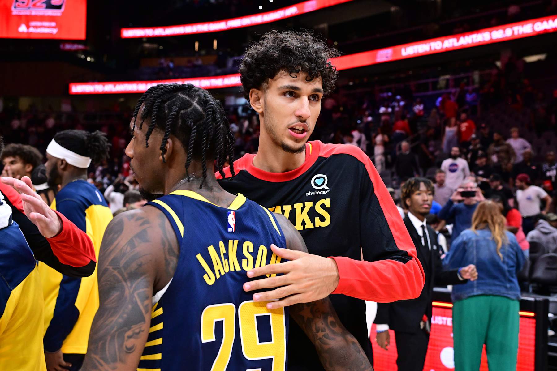 ATLANTA, GA - OCTOBER 8: Zaccharie Risacher #10 of the Atlanta Hawks and Quenton Jackson #29 of the Indiana Pacers embrace after the game during a NBA preseason game on October 8, 2024 at State Farm Arena in Atlanta, Georgia.  NOTE TO USER: User expressly acknowledges and agrees that, by downloading and/or using this Photograph, user is consenting to the terms and conditions of the Getty Images License Agreement. Mandatory Copyright Notice: Copyright 2024 NBAE (Photo by Adam Hagy/NBAE via Getty Images)