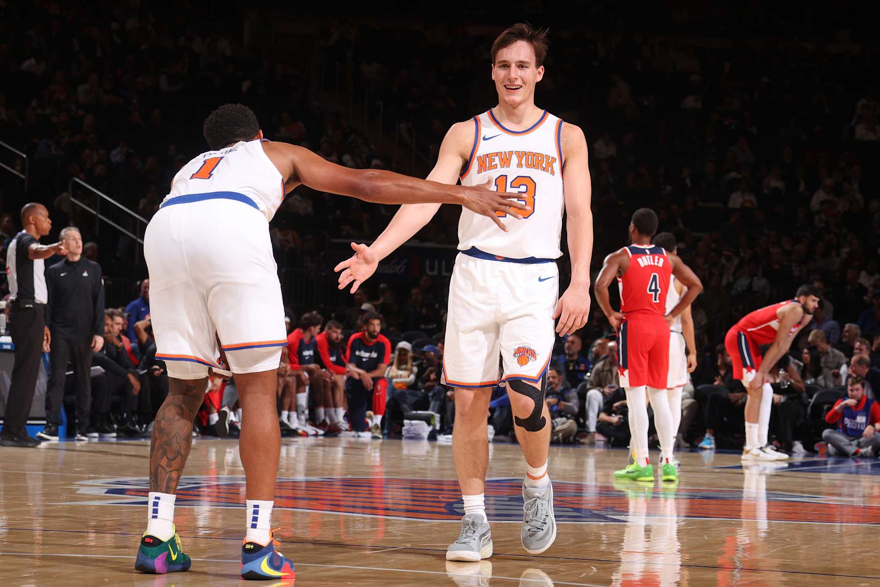 NEW YORK, NY - OCTOBER 9: Cameron Payne #1 and Tyler Kolek #13 of the New York Knicks high five during the game against the Washington Wizards during the 2024 NBA Preseason on October 9, 2024 at Madison Square Garden in New York City, New York.  NOTE TO USER: User expressly acknowledges and agrees that, by downloading and or using this photograph, User is consenting to the terms and conditions of the Getty Images License Agreement. Mandatory Copyright Notice: Copyright 2024 NBAE  (Photo by Nathaniel S. Butler/NBAE via Getty Images)