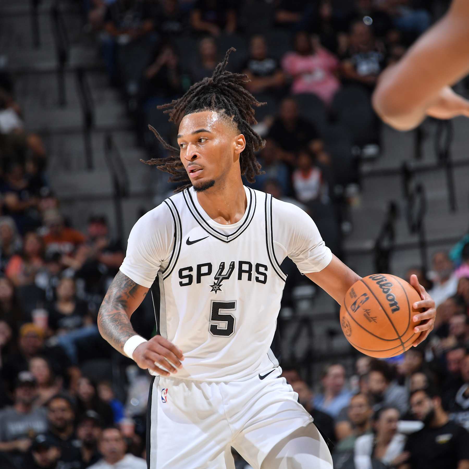 SAN ANTONIO, TX - OCTOBER 12: Stephon Castle #5 of the San Antonio Spurs dribbles the ball during the game against the Utah Jazz during a NBA pre season game on October 12, 2024 at the Frost Bank Center in San Antonio, Texas. NOTE TO USER: User expressly acknowledges and agrees that, by downloading and or using this photograph, user is consenting to the terms and conditions of the Getty Images License Agreement. Mandatory Copyright Notice: Copyright 2024 NBAE (Photos by Michael Gonzales/NBAE via Getty Images)