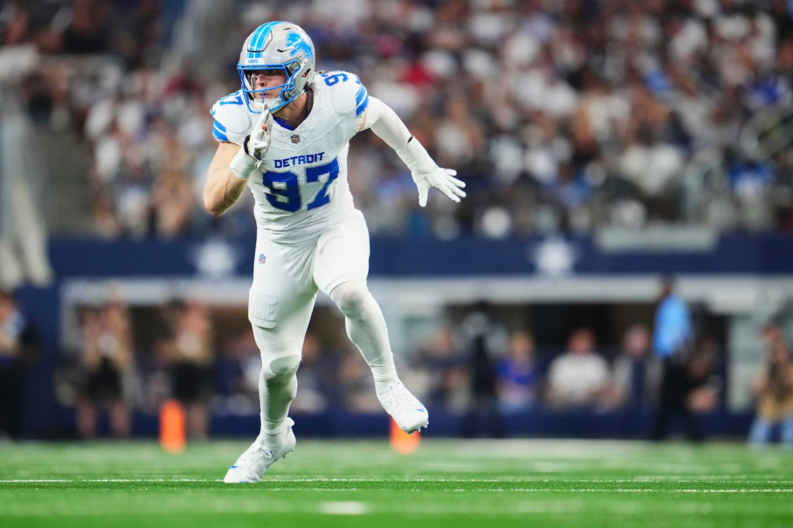 ARLINGTON, TX - OCTOBER 13: Aidan Hutchinson #97 of the Detroit Lions defends against the Dallas Cowboys during the first half of an NFL football game at AT&T Stadium on October 13, 2024 in Arlington, Texas. (Photo by Cooper Neill/Getty Images)