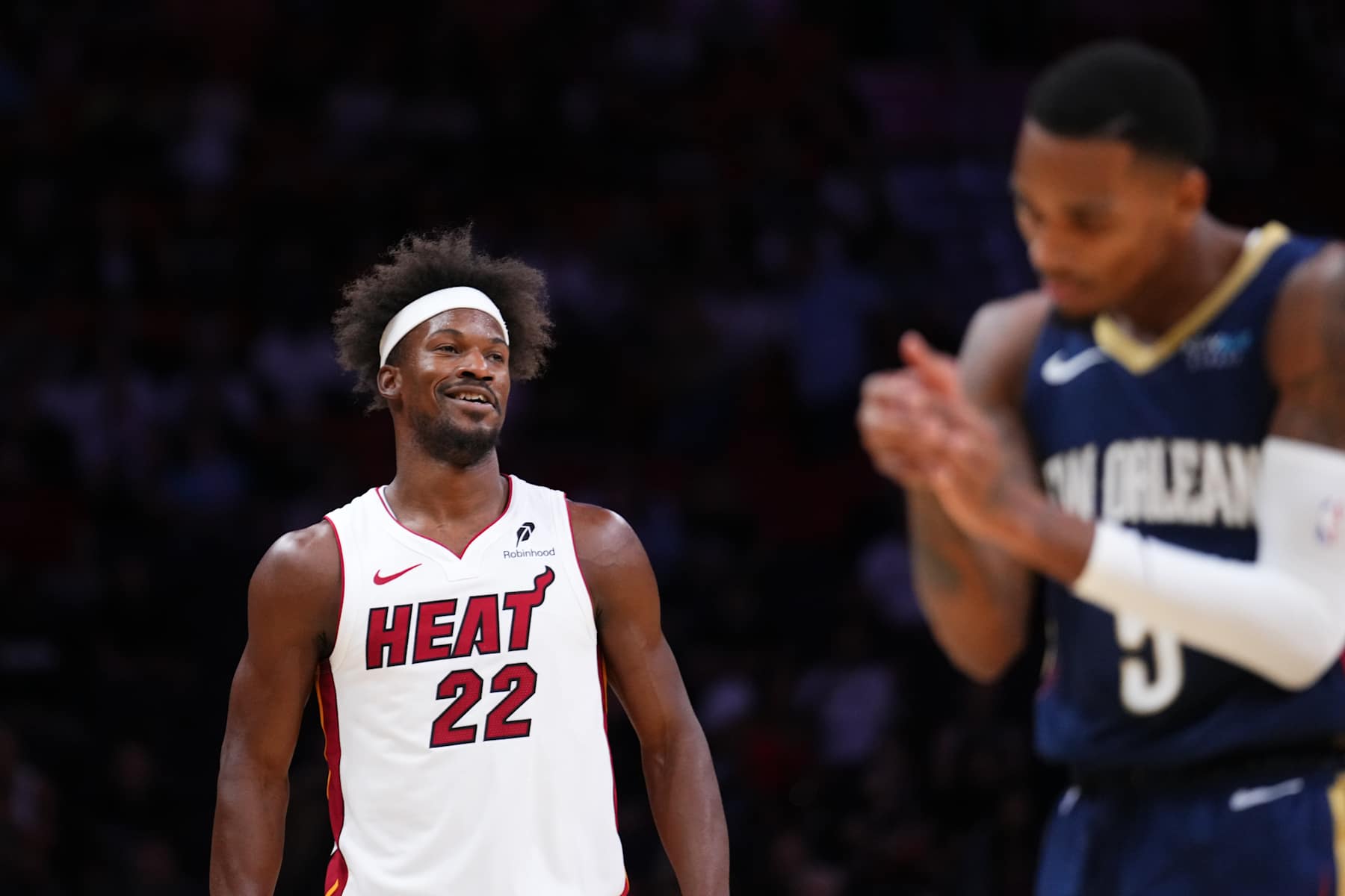 MIAMI, FLORIDA - OCTOBER 13: Jimmy Butler #22 of the Miami Heat reacts against the New Orleans Pelicans during the first quarter of a preseason game at Kaseya Center on October 13, 2024 in Miami, Florida. NOTE TO USER: User expressly acknowledges and agrees that, by downloading and or using this photograph, User is consenting to the terms and conditions of the Getty Images License Agreement. (Photo by Rich Storry/Getty Images)
