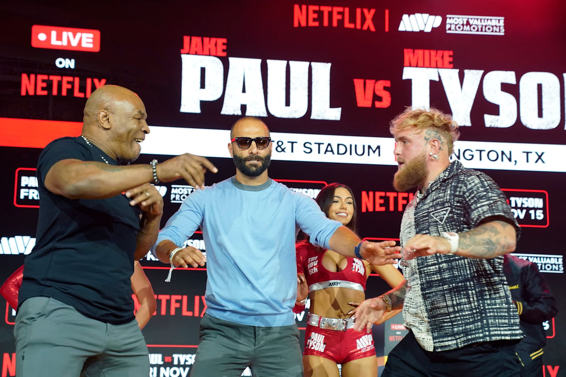(L-R) Former US heavyweight boxing champion Mike Tyson and US YouTuber and boxer Jake Paul face off during a press conference at Fanatics Fest NYC on August 18, 2024, in New York City. The heavyweight match has been rescheduled for November 15, 2024, and will take place in Arlington, Texas. (Photo by TIMOTHY A. CLARY / AFP) (Photo by TIMOTHY A. CLARY/AFP via Getty Images)