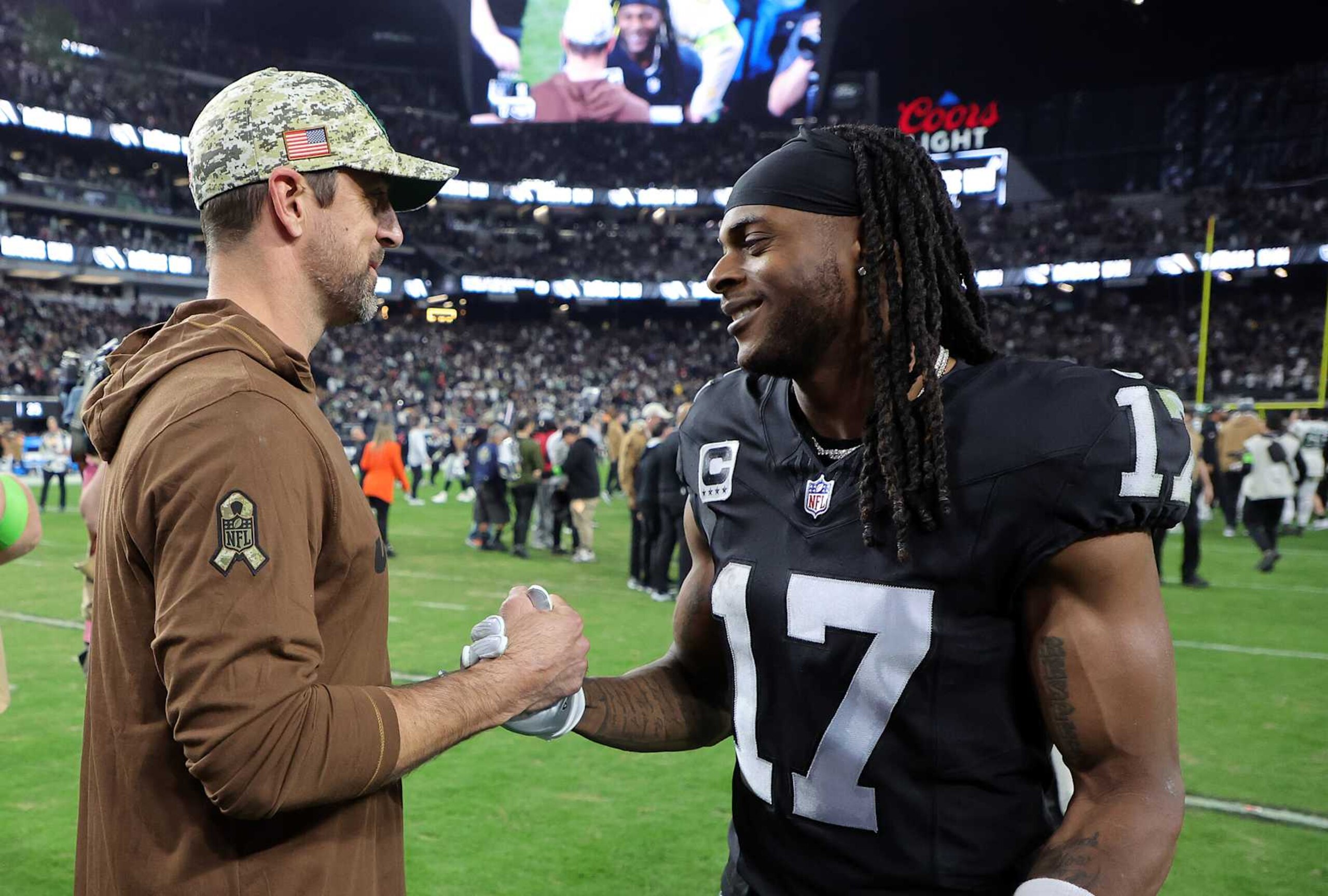 LAS VEGAS, NEVADA - NOVEMBER 12:  Quarterback Aaron Rodgers #8 of the New York Jets talks with wide receiver Davante Adams #17 of the Las Vegas Raiders after the Raiders defeated the Jets to win the game at Allegiant Stadium on November 12, 2023 in Las Vegas, Nevada. (Photo by Ethan Miller/Getty Images)