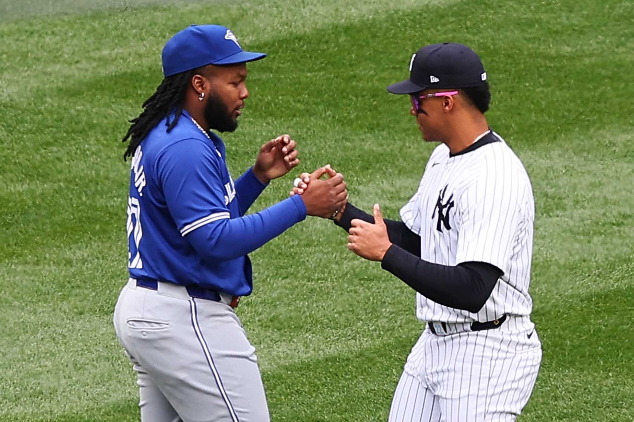 BRONX, NY - APRIL 05:  Juan Soto #22 of the New York Yankees and Vladimir Guerrero Jr. #27 of the Toronto Blue Jays talk in the outfield prior to the game on April 5, 2024 at Yankee Stadium in the Bronx, New York.  (Photo by Rich Graessle/Icon Sportswire via Getty Images)