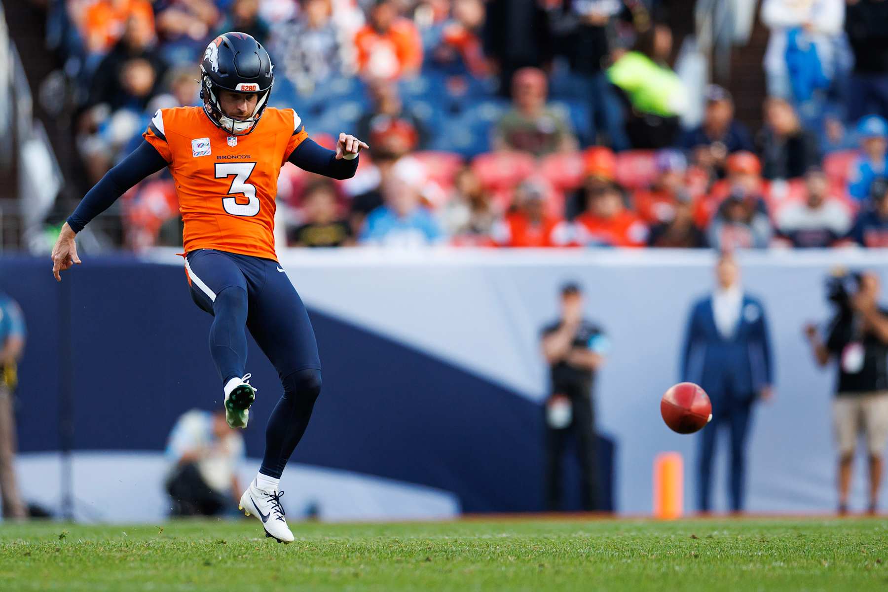 DENVER, COLORADO - OCTOBER 13: Place kicker Wil Lutz #3 of the Denver Broncos attempts an onside kick during the fourth quarter of an NFL football game against the Los Angeles Chargers at Empower Field at Mile High on October 13, 2024 in Denver, Colorado. (Photo by Brooke Sutton/Getty Images)