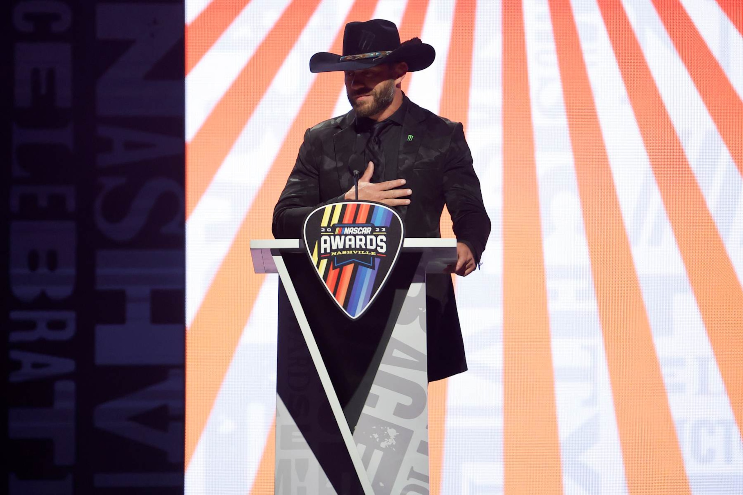 NASHVILLE, TENNESSEE - NOVEMBER 30: UFC fighter Donald "Cowboy" Cerrone (L) introduces retired NASCAR Cup Series driver Kurt Busch onstage during the NASCAR Awards and Champion Celebration at the Music City Center on November 30, 2023 in Nashville, Tennessee. (Photo by Chris Graythen/Getty Images)