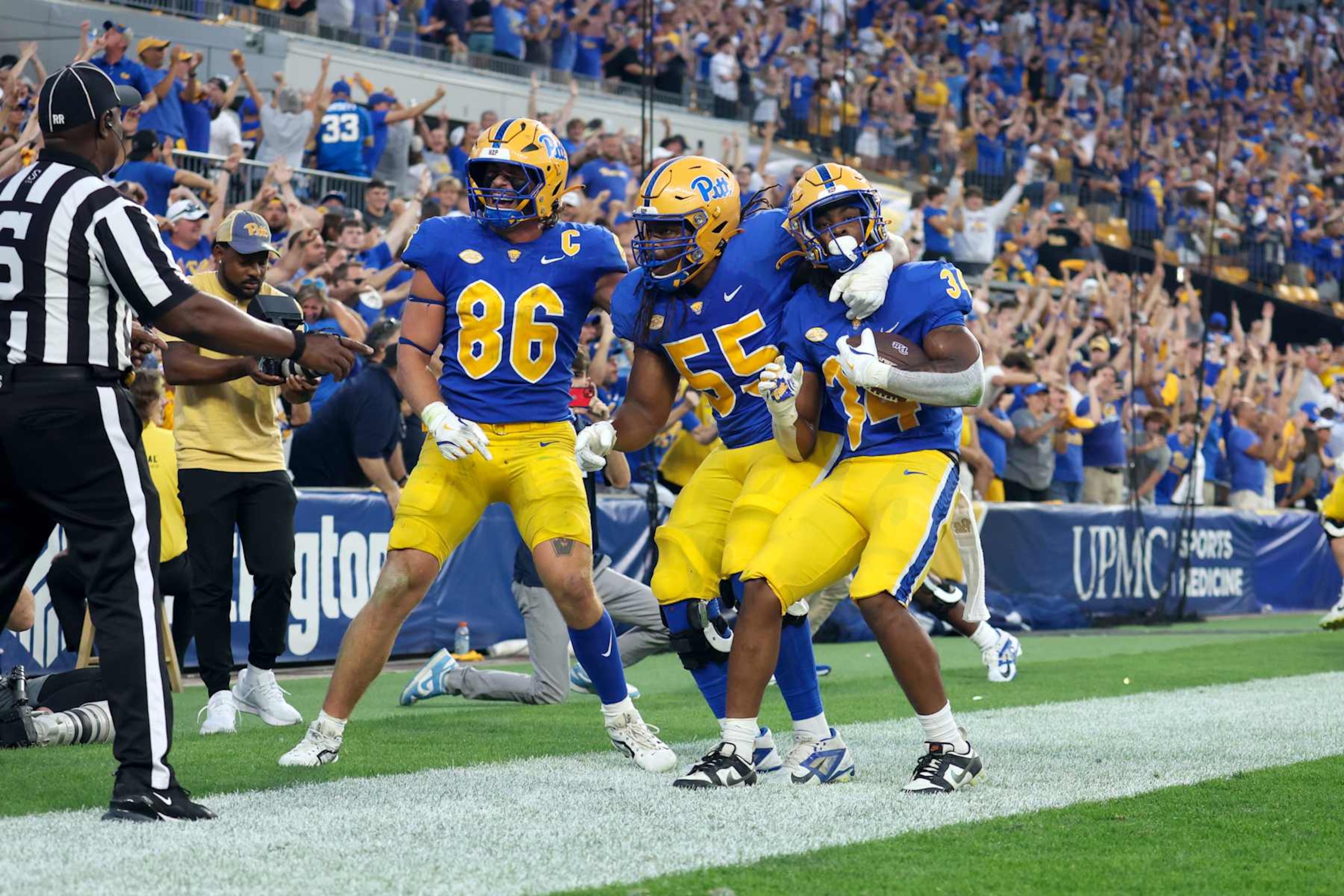 Gavin Bartholomew, BJ Williams and Derrick Davis Jr. celebrate a score.