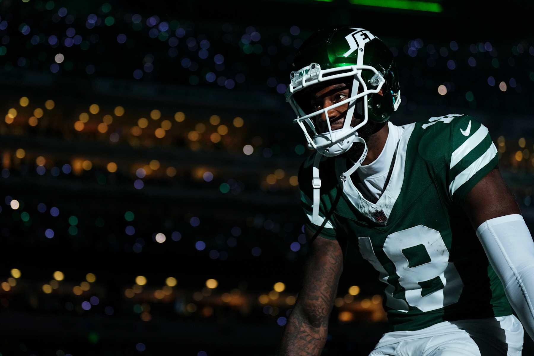 EAST RUTHERFORD, NJ - SEPTEMBER 19: Mike Williams #18 of the New York Jets runs out of the tunnel prior to an NFL football game against the New England Patriots at MetLife Stadium on September 19, 2024 in East Rutherford, New Jersey. (Photo by Cooper Neill/Getty Images)