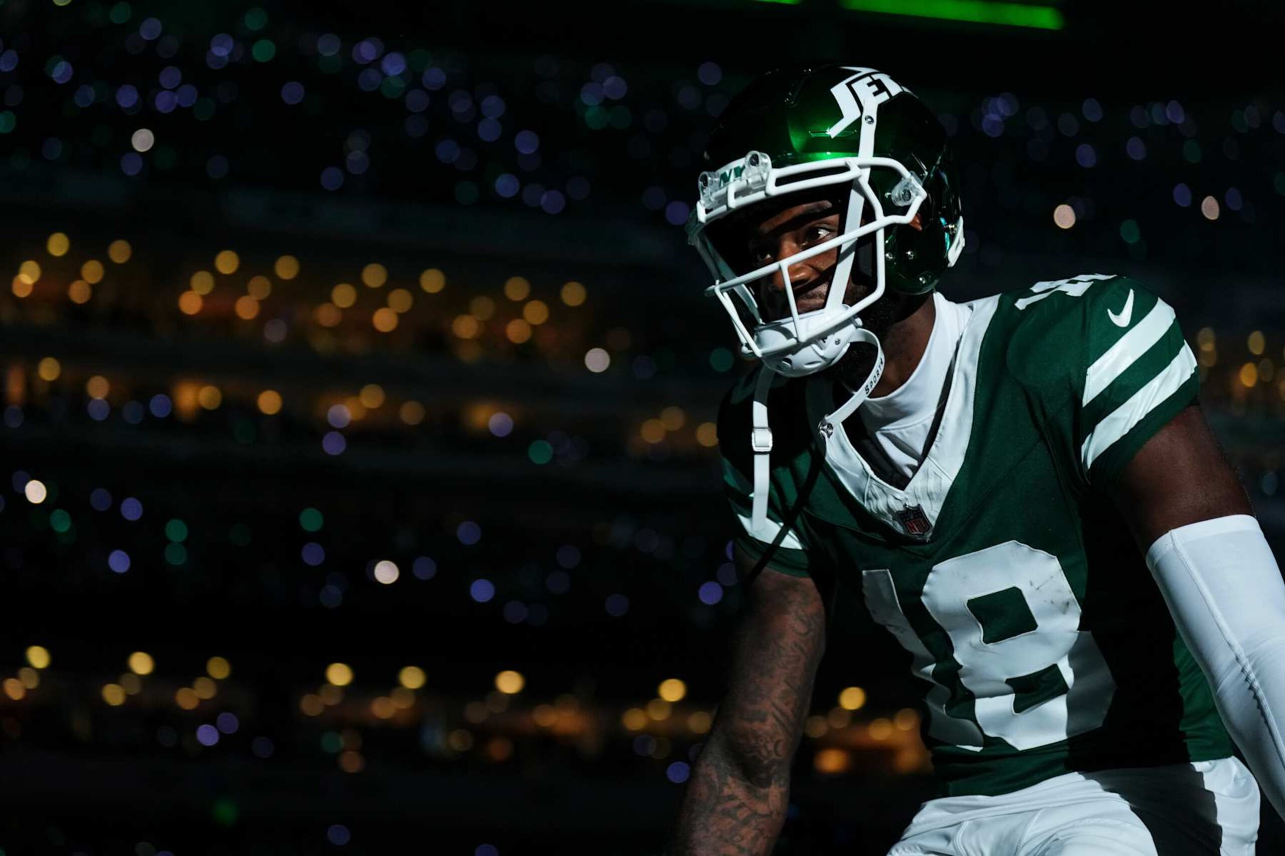 EAST RUTHERFORD, NJ - SEPTEMBER 19: Mike Williams #18 of the New York Jets runs out of the tunnel prior to an NFL football game against the New England Patriots at MetLife Stadium on September 19, 2024 in East Rutherford, New Jersey. (Photo by Cooper Neill/Getty Images)