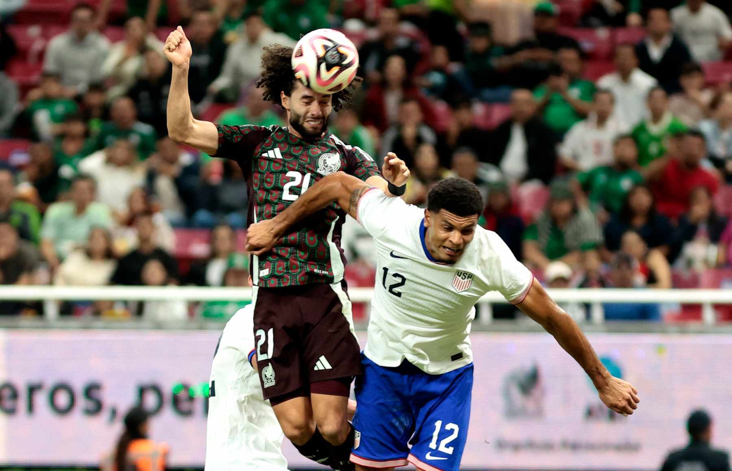 Mexico's forward #21 Cesar Huerta and USA's defender #12 Miles Robinson fight for the ball during the international friendly football match between Mexico and USA at the Akron Stadium in Zapopan, Jalisco state, Mexico, on October 15, 2024. (Photo by Ulises Ruiz / AFP) (Photo by ULISES RUIZ/AFP via Getty Images) Mexico's forward #21 Cesar Huerta and USA's defender #12 Miles Robinson fight for the ball during the international friendly football match between Mexico and USA at the Akron Stadium in Zapopan, Jalisco state, Mexico, on October 15, 2024. (Photo by Ulises Ruiz / AFP) (Photo by ULISES RUIZ/AFP via Getty Images)
