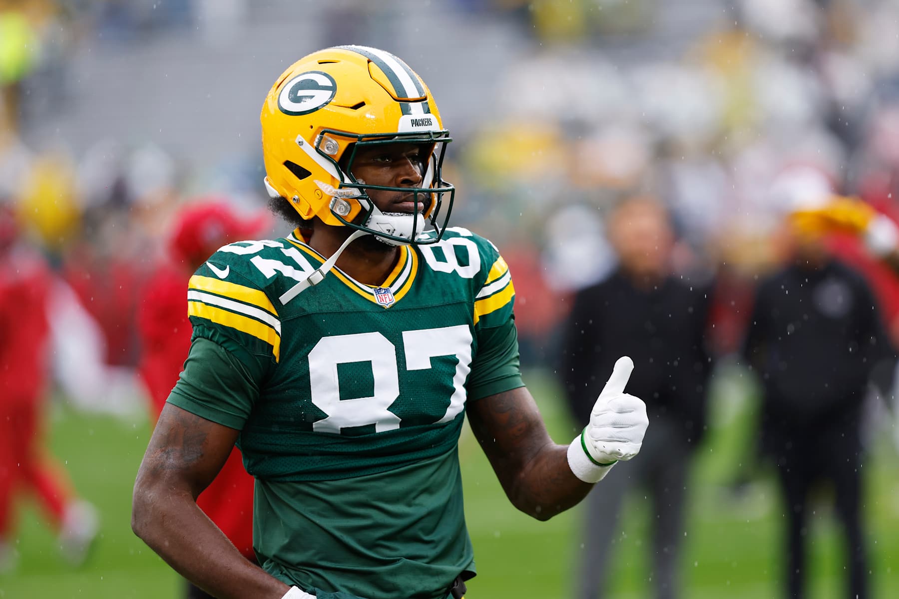 GREEN BAY, WI - OCTOBER 13: Green Bay Packers wide receiver Romeo Doubs (87) signals he's ready to go prior to  a game between the Green Bay Packers and the Arizona Cardinals at Lambeau Field on October 13, 2024 in Green Bay, WI. (Photo by Larry Radloff/Icon Sportswire via Getty Images)
