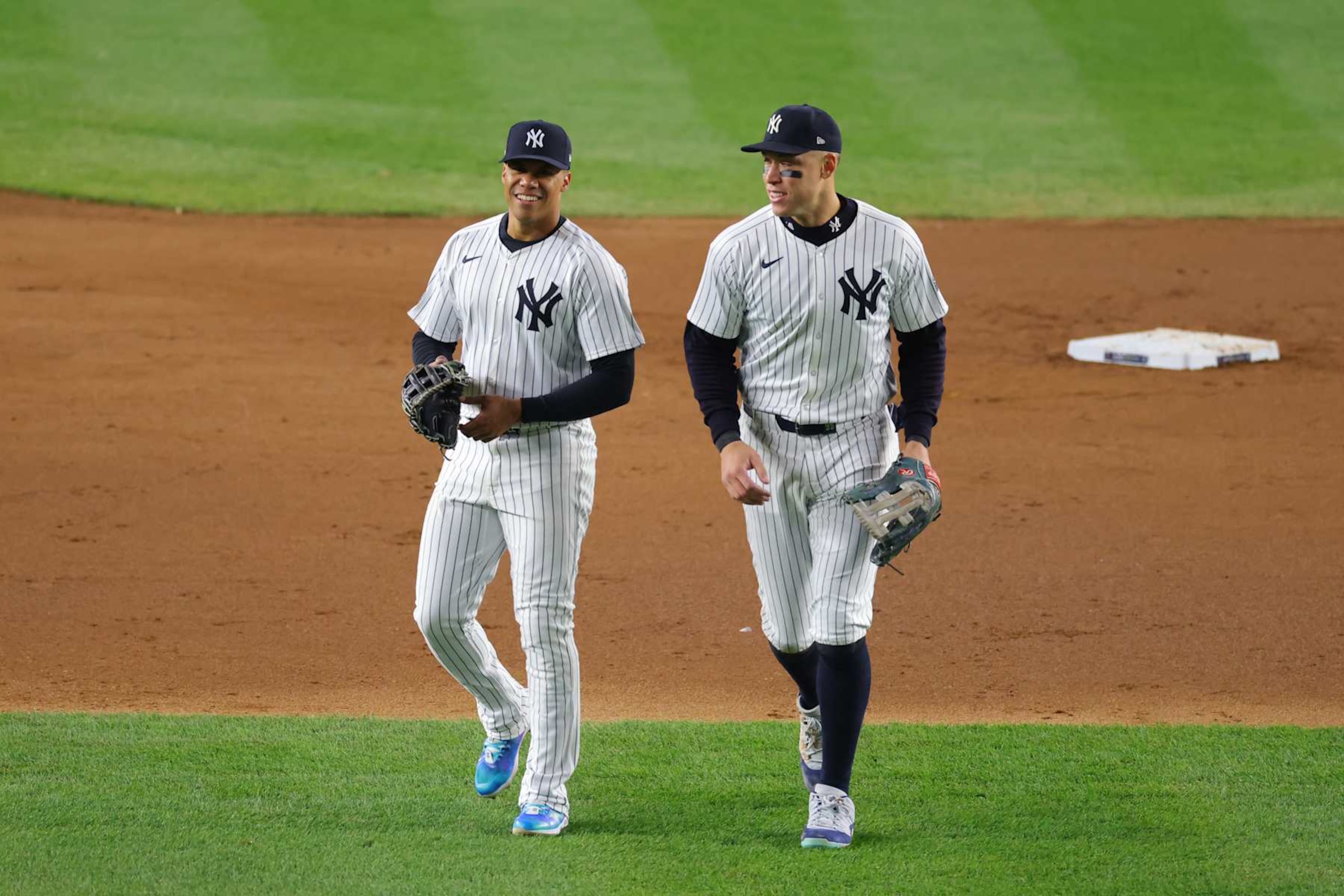 NEW YORK, NEW YORK - OCTOBER 14:  Juan Soto #22 of the New York Yankees jokes with Aaron Judge #99 during the 4th inning of Game One of the American League Championship Series against the Cleveland Guardians at Yankee Stadium on October 14, 2024 in New York City. (Photo by Mike Stobe/Getty Images)
