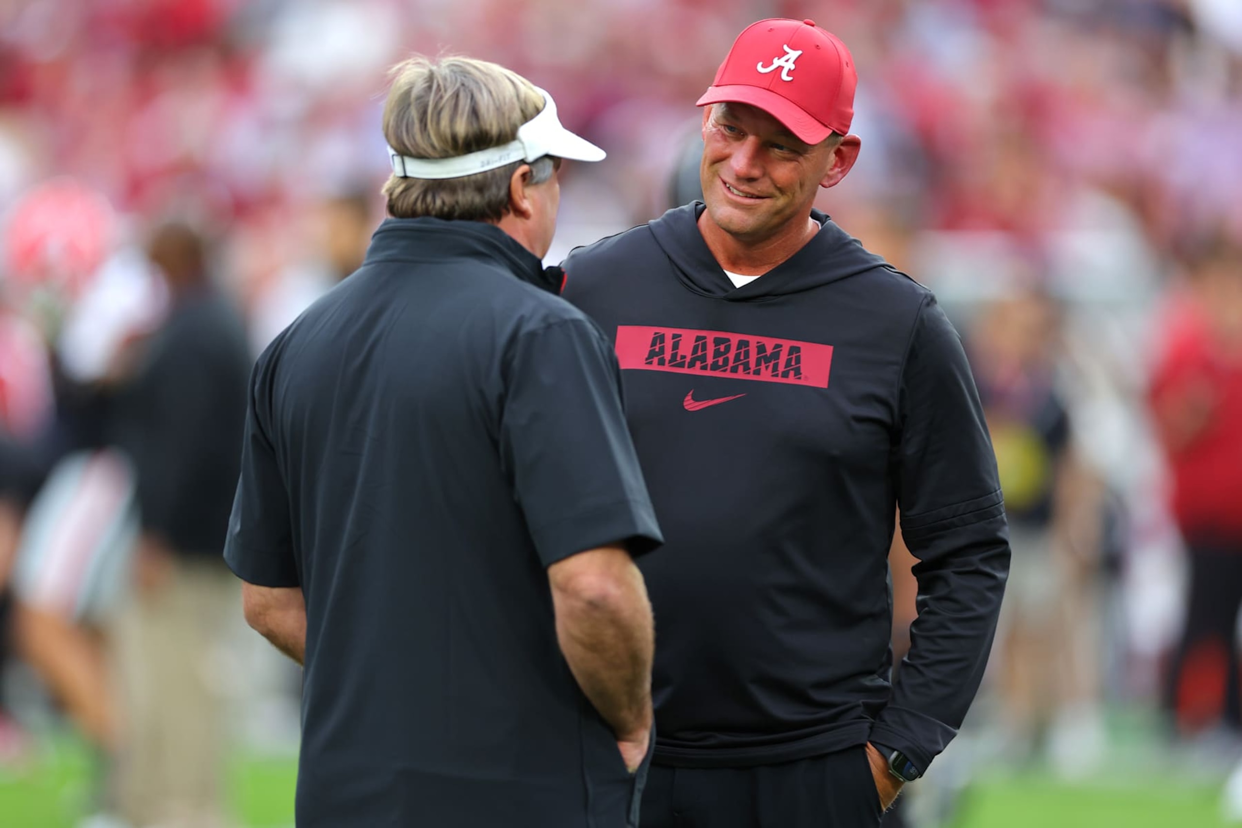 TUSCALOOSA, ALABAMA - SEPTEMBER 28: Head coach Kalen DeBoer of the Alabama Crimson Tide speaks to head coach Kirby Smart of the Georgia Bulldogs before the game at Bryant-Denny Stadium on September 28, 2024 in Tuscaloosa, Alabama. (Photo by Kevin C. Cox/Getty Images)