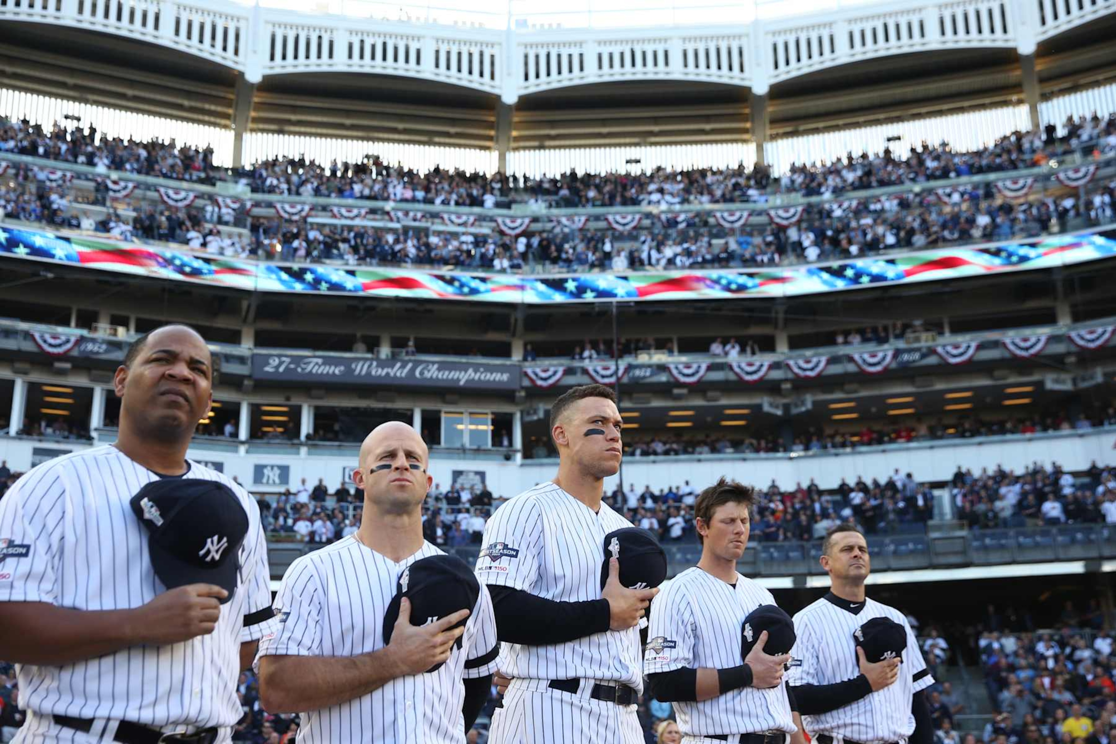 BRONX, NY - OCTOBER 15: Members of the New York Yankees stand for the national anthem prior to Game 3 of the ALCS between the Houston Astros and the New York Yankees at Yankee Stadium on Tuesday, October 15, 2019 in the Bronx borough of New York City. (Photo by Rob Tringali/MLB Photos via Getty Images) BRONX, NY - OCTOBER 15: Members of the New York Yankees stand for the national anthem prior to Game 3 of the ALCS between the Houston Astros and the New York Yankees at Yankee Stadium on Tuesday, October 15, 2019 in the Bronx borough of New York City. (Photo by Rob Tringali/MLB Photos via Getty Images)