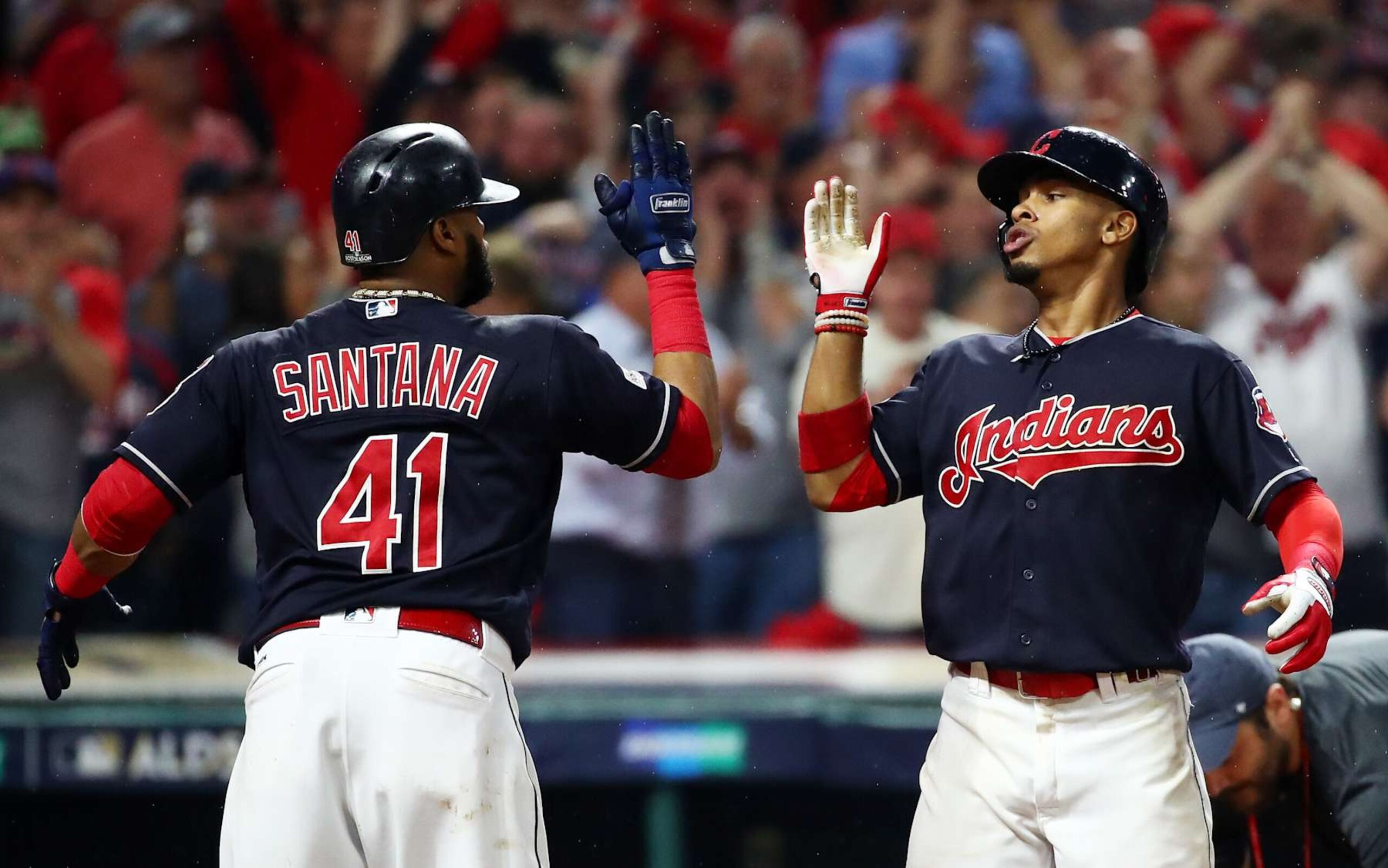 CLEVELAND, OH - OCTOBER 06:  Francisco Lindor #12 of the Cleveland Indians celebrates his grand slam with Carlos Santana #41 in the sixth inning during game two of the American League Division Series at Progressive Field on October 6, 2017 in Cleveland, Ohio.  (Photo by Gregory Shamus/Getty Images)