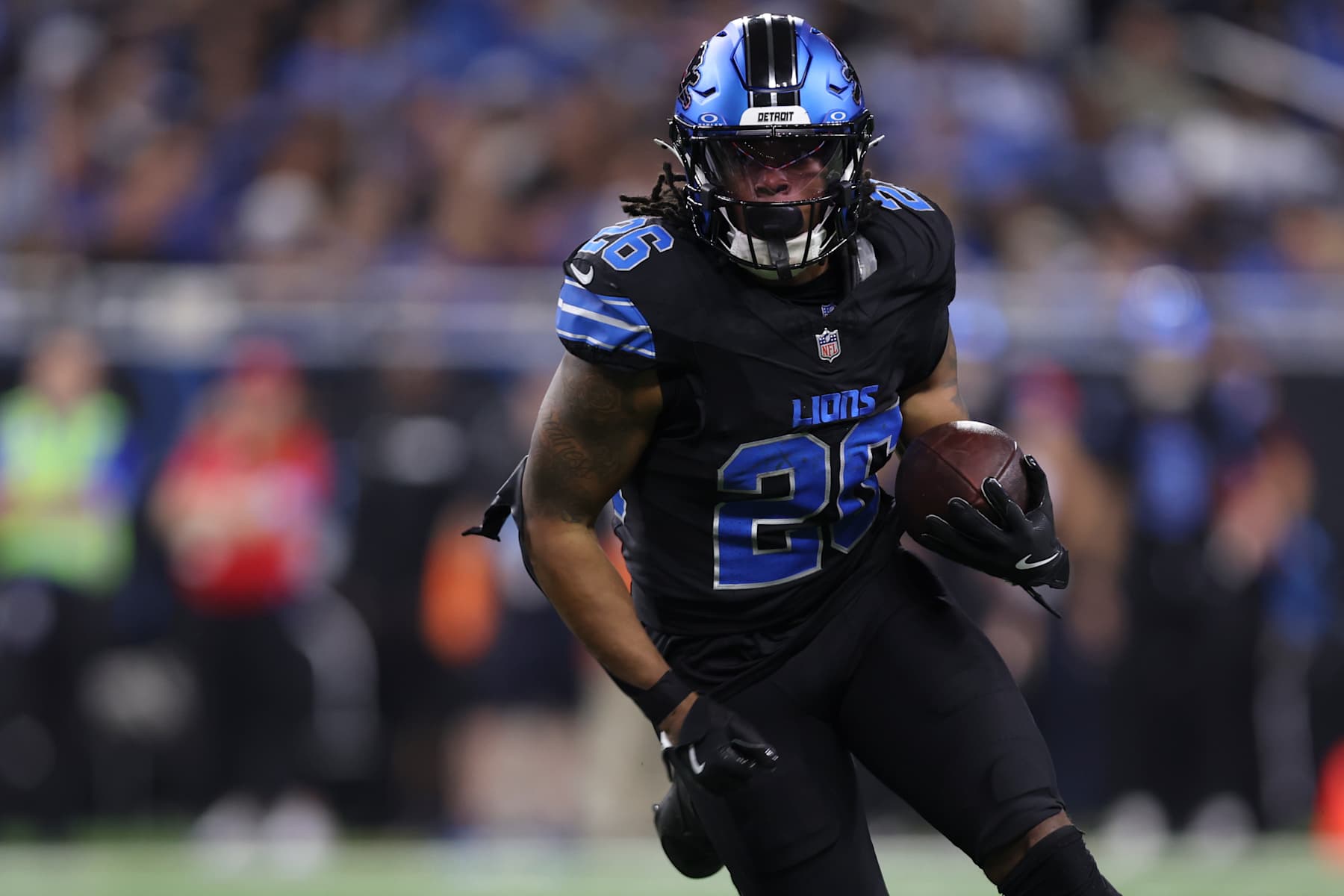 DETROIT, MICHIGAN - SEPTEMBER 30: Jahmyr Gibbs #26 of the Detroit Lions runs the ball during an NFL football game against the Seattle Seahawks at Ford Field on September 30, 2024 in Detroit, Michigan. (Photo by Perry Knotts/Getty Images)