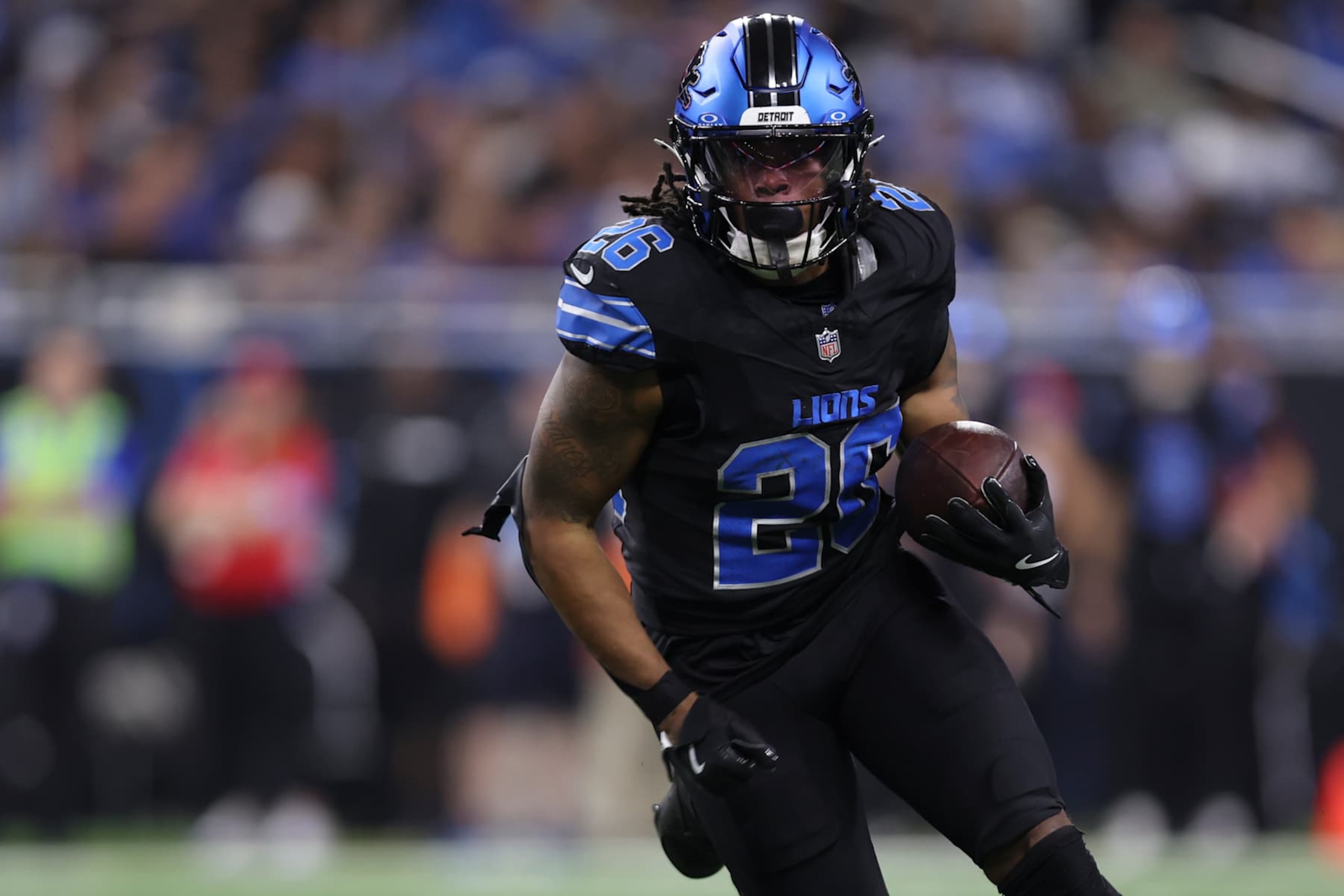 DETROIT, MICHIGAN - SEPTEMBER 30: Jahmyr Gibbs #26 of the Detroit Lions runs the ball during an NFL football game against the Seattle Seahawks at Ford Field on September 30, 2024 in Detroit, Michigan. (Photo by Perry Knotts/Getty Images)