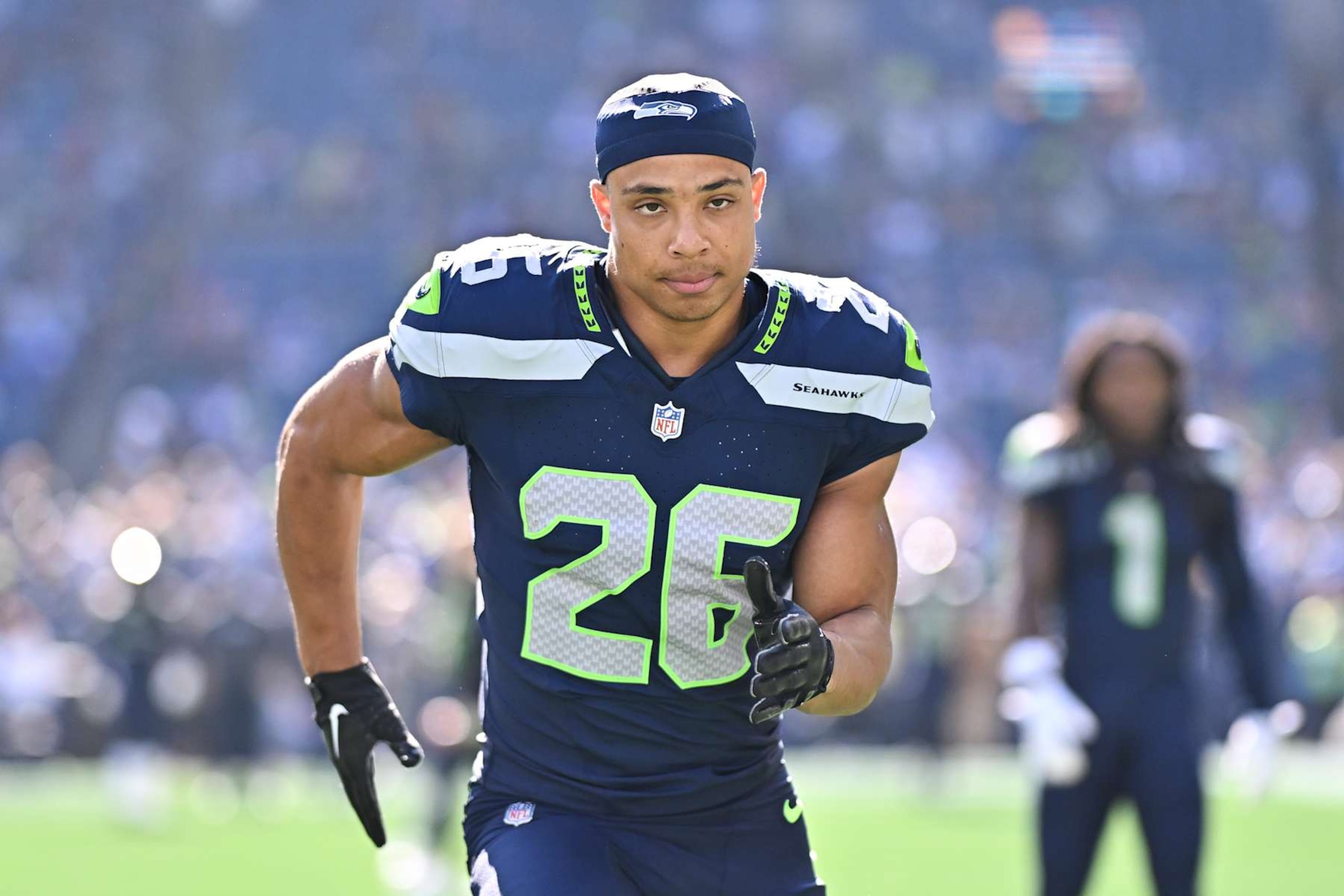 SEATTLE, WASHINGTON - OCTOBER 06: Zach Charbonnet #26 of the Seattle Seahawks warms up before the game against the New York Giants at Lumen Field on October 06, 2024 in Seattle, Washington. The New York Giants won 29-20. (Photo by Alika Jenner/Getty Images)