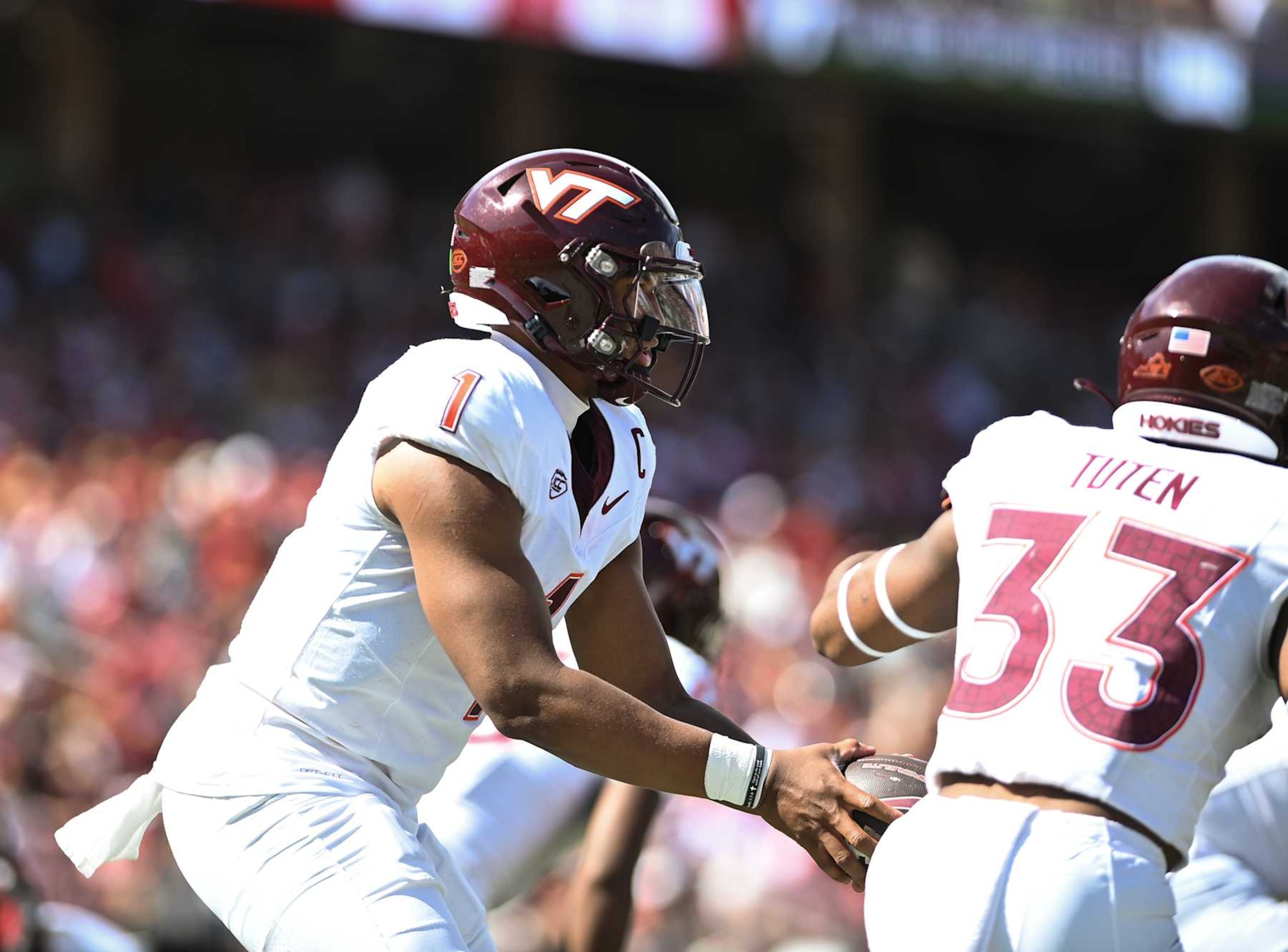 PALO ALTO, CA - OCTOBER 05: Virginia Tech Hokies quarterback Kyron Drones (1) hands the ball off during the college football game between the Stanford Cardinal and the Virginia Tech Hokies on October 5, 2024, at Stanford Stadium in Palo Alto, CA. (Photo by Samuel Stringer/Icon Sportswire via Getty Images)