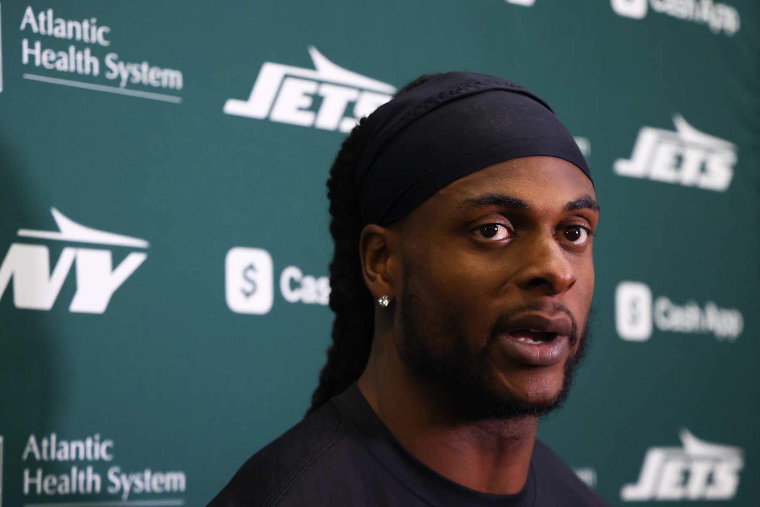 EAST RUTHERFORD, NEW JERSEY - OCTOBER 16: Davante Adams #17 of the New York Jets speaks to members of the media at the Atlantic Health Jets Training Center on October 16, 2024 in Florham Park, New Jersey. (Photo by Ed Mulholland/Getty Images)