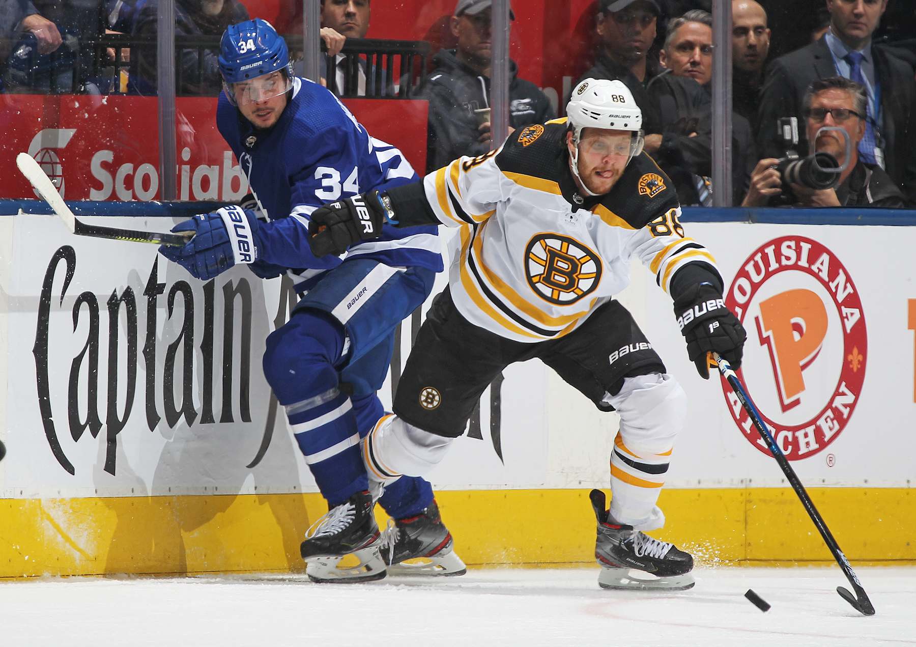 TORONTO, ON - APRIL 17:  David Pastrnak #88 of the Boston Bruins battles against Auston Matthews #34 of the Toronto Maple Leafs in Game Four of the Eastern Conference First Round during the 2019 NHL Stanley Cup Playoffs at Scotiabank Arena on April 17, 2019 in Toronto, Ontario, Canada. The Bruins defeated the Maple Leafs 6-4. (Photo by Claus Andersen/Getty Images)