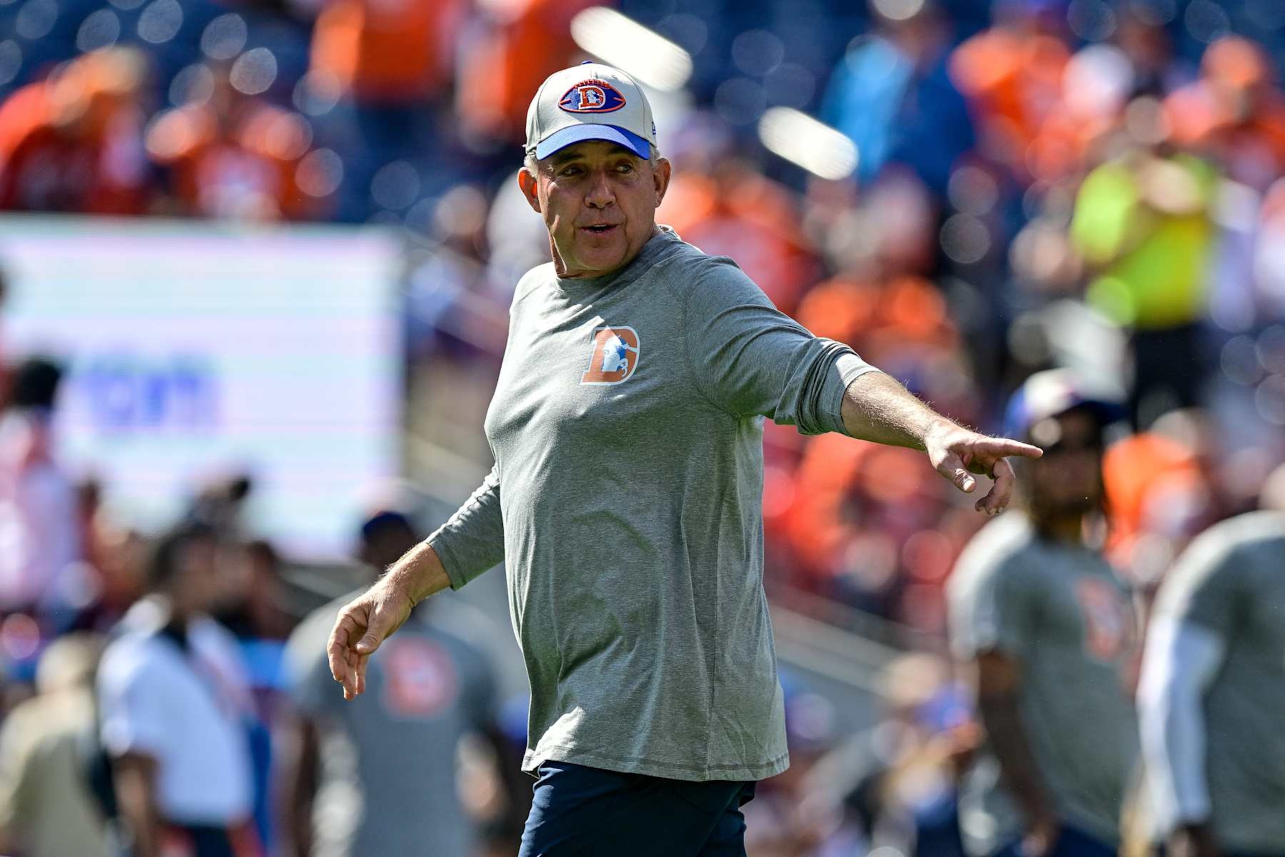 DENVER, CO - OCTOBER 6: Denver Broncos head coach Sean Payton greets players as they stretch on the field before a game between the Las Vegas Raiders and the Denver Broncos at Empower Field at Mile High on October 6, 2024 in Denver, Colorado. (Photo by Dustin Bradford/Icon Sportswire via Getty Images)