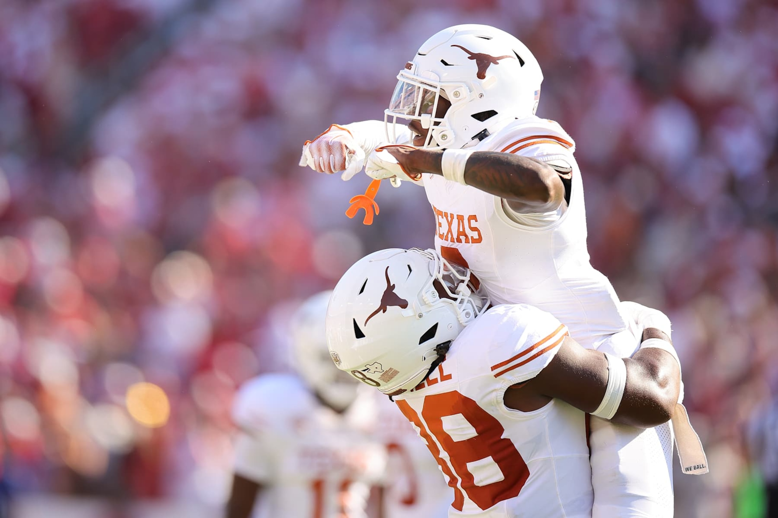 DALLAS, TEXAS - OCTOBER 12: Derek Williams Jr. #2 of the Texas Longhorns celebrates a fumble recovery with Barryn Sorrell #88 during the second quarter against the Oklahoma Sooners at Cotton Bowl Stadium on October 12, 2024 in Dallas, Texas. (Photo by Alex Slitz/Getty Images)