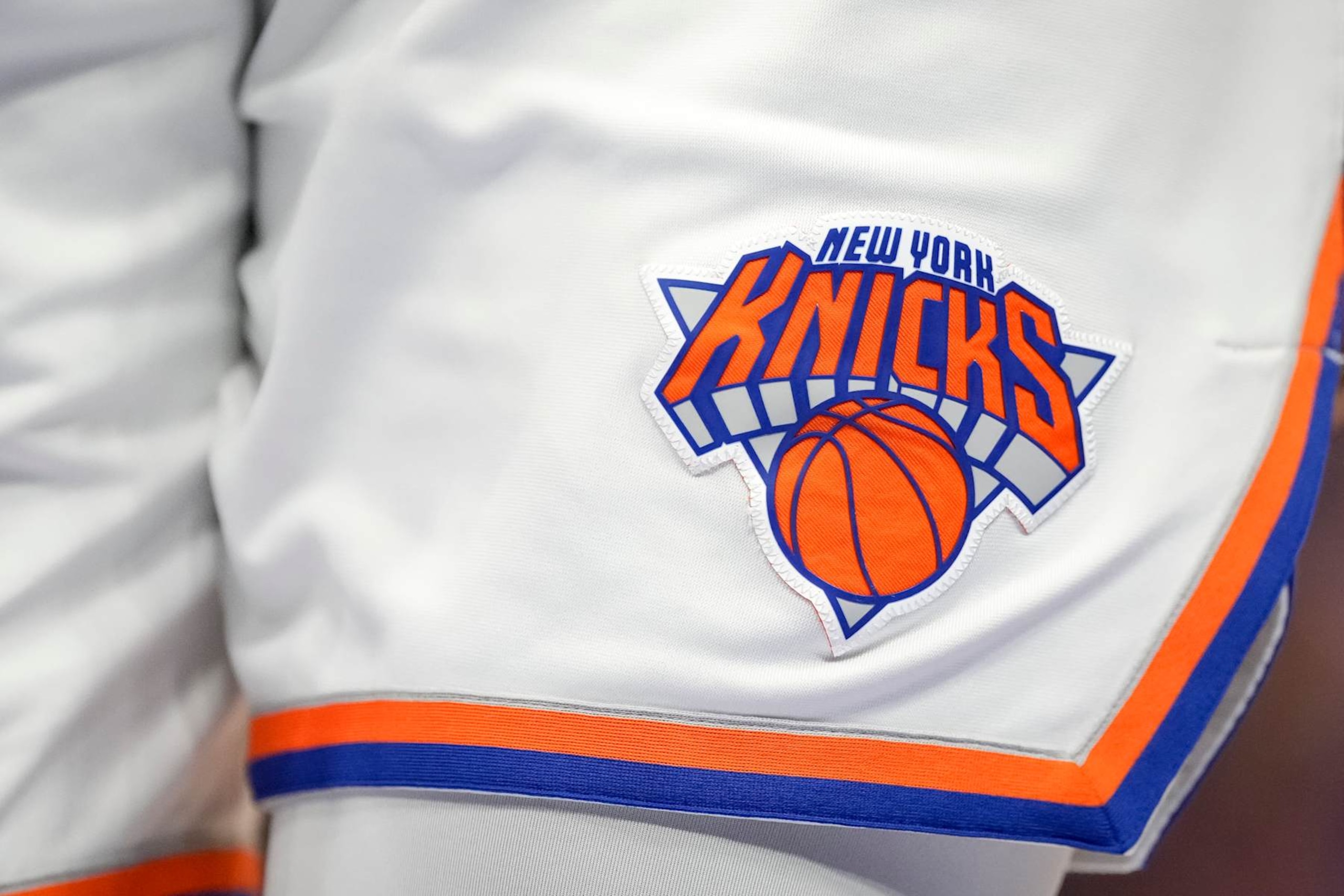 DETROIT, MICHIGAN - MARCH 27: A detail is pictured of the New York Knicks uniform and New York Knicks logo during the fourth quarter against the Detroit Pistons at Little Caesars Arena on March 27, 2022 in Detroit, Michigan. NOTE TO USER: User expressly acknowledges and agrees that, by downloading and or using this photograph, User is consenting to the terms and conditions of the Getty Images License Agreement. (Photo by Nic Antaya/Getty Images) DETROIT, MICHIGAN - MARCH 27: A detail is pictured of the New York Knicks uniform and New York Knicks logo during the fourth quarter against the Detroit Pistons at Little Caesars Arena on March 27, 2022 in Detroit, Michigan. NOTE TO USER: User expressly acknowledges and agrees that, by downloading and or using this photograph, User is consenting to the terms and conditions of the Getty Images License Agreement. (Photo by Nic Antaya/Getty Images)