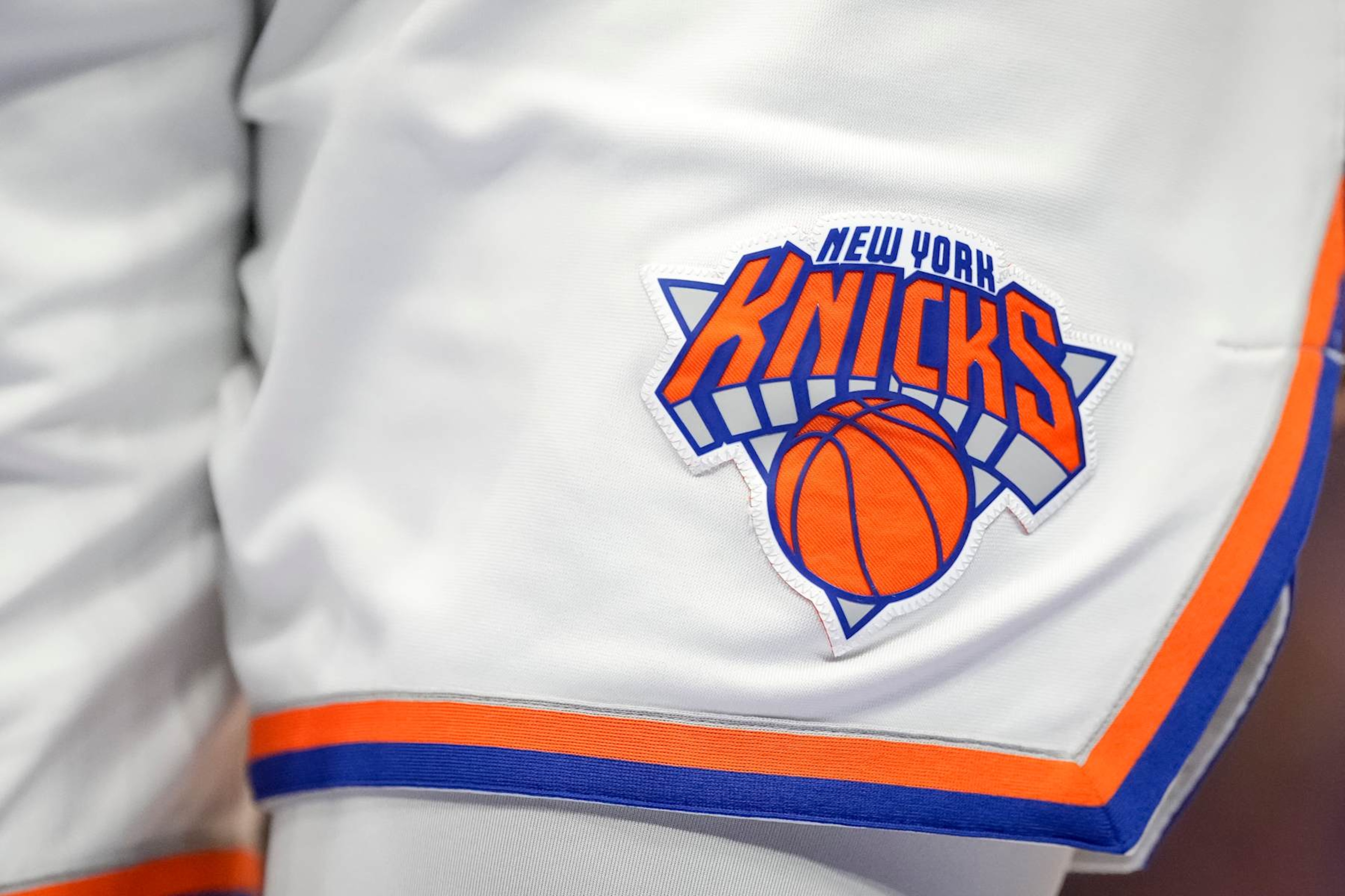 DETROIT, MICHIGAN - MARCH 27: A detail is pictured of the New York Knicks uniform and New York Knicks logo during the fourth quarter against the Detroit Pistons at Little Caesars Arena on March 27, 2022 in Detroit, Michigan. NOTE TO USER: User expressly acknowledges and agrees that, by downloading and or using this photograph, User is consenting to the terms and conditions of the Getty Images License Agreement. (Photo by Nic Antaya/Getty Images) DETROIT, MICHIGAN - MARCH 27: A detail is pictured of the New York Knicks uniform and New York Knicks logo during the fourth quarter against the Detroit Pistons at Little Caesars Arena on March 27, 2022 in Detroit, Michigan. NOTE TO USER: User expressly acknowledges and agrees that, by downloading and or using this photograph, User is consenting to the terms and conditions of the Getty Images License Agreement. (Photo by Nic Antaya/Getty Images)