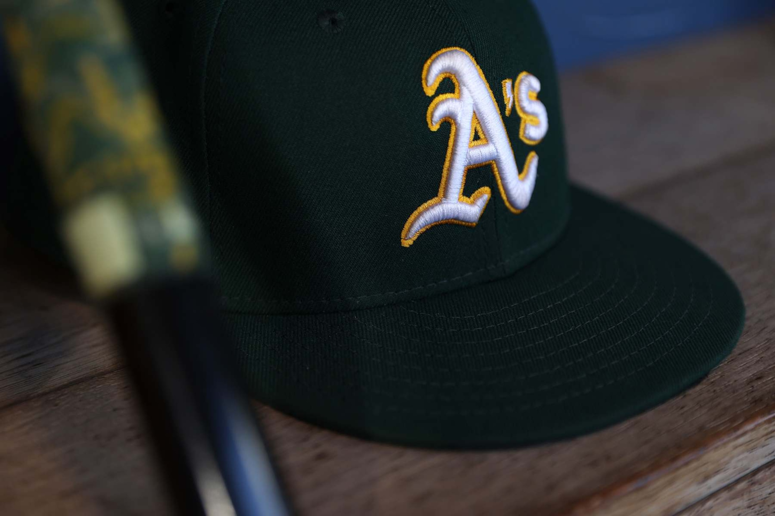 SEATTLE, WASHINGTON - SEPTEMBER 27: A general view of an Oakland Athletics logo and hat before the game against the Seattle Mariners at T-Mobile Park on September 27, 2024 in Seattle, Washington. (Photo by Steph Chambers/Getty Images)