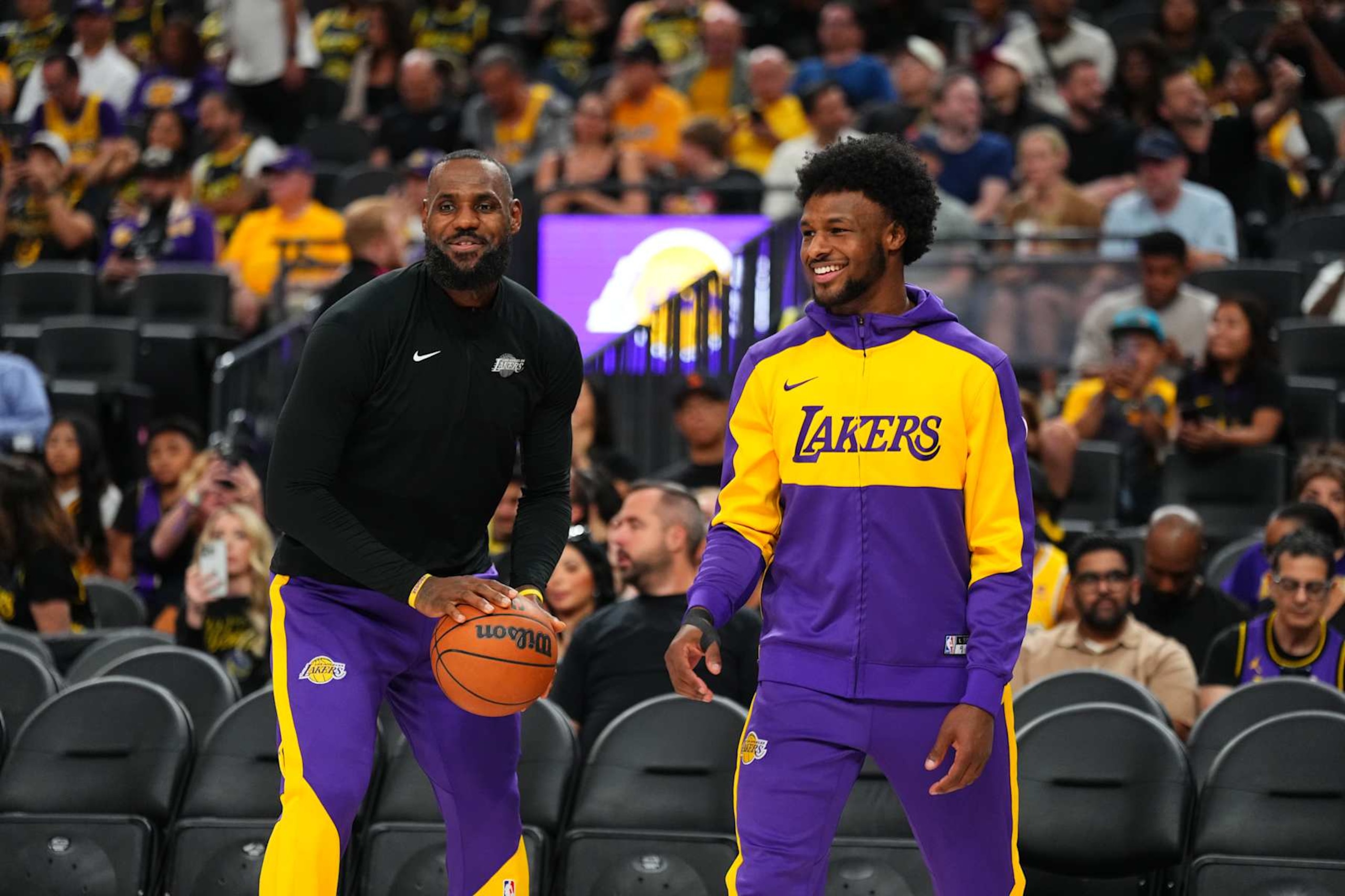 LAS VEGAS, NV - OCTOBER 15: LeBron James #23 and Bronny James #9 of the Los Angeles Lakers warms up before the game before the game against the Golden State Warriors during the 2024 NBA Preseason on October 15, 2024 at T-Mobile Arena in Las Vegas, Nevada. NOTE TO USER: User expressly acknowledges and agrees that, by downloading and or using this photograph, User is consenting to the terms and conditions of the Getty Images License Agreement. Mandatory Copyright Notice: Copyright 2024 NBAE  (Photo by Jeff Bottari/NBAE via Getty Images)