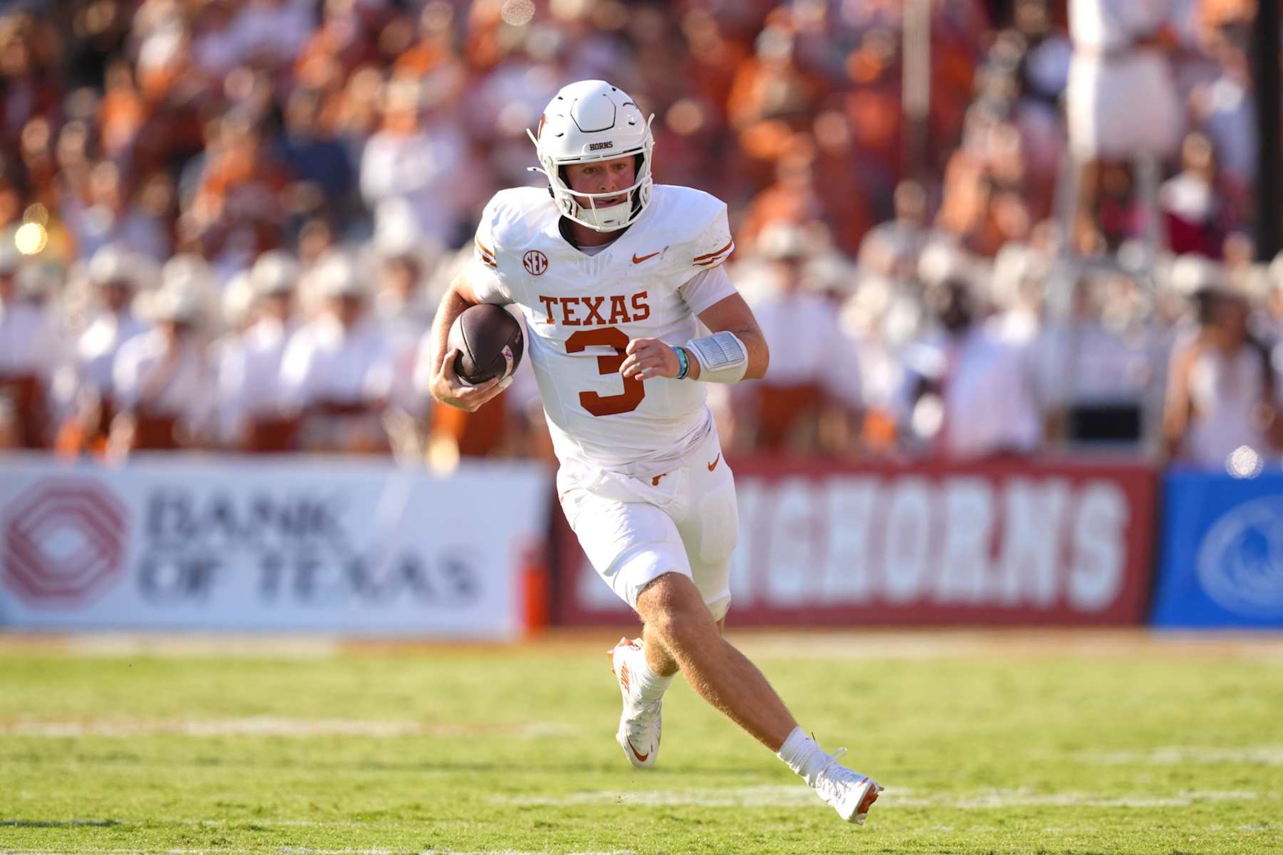 DALLAS, TEXAS - OCTOBER 12: Quinn Ewers #3 of the Texas Longhorns runs with the ball during the second half against the Oklahoma Sooners at Cotton Bowl Stadium on October 12, 2024 in Dallas, Texas. (Photo by Sam Hodde/Getty Images)