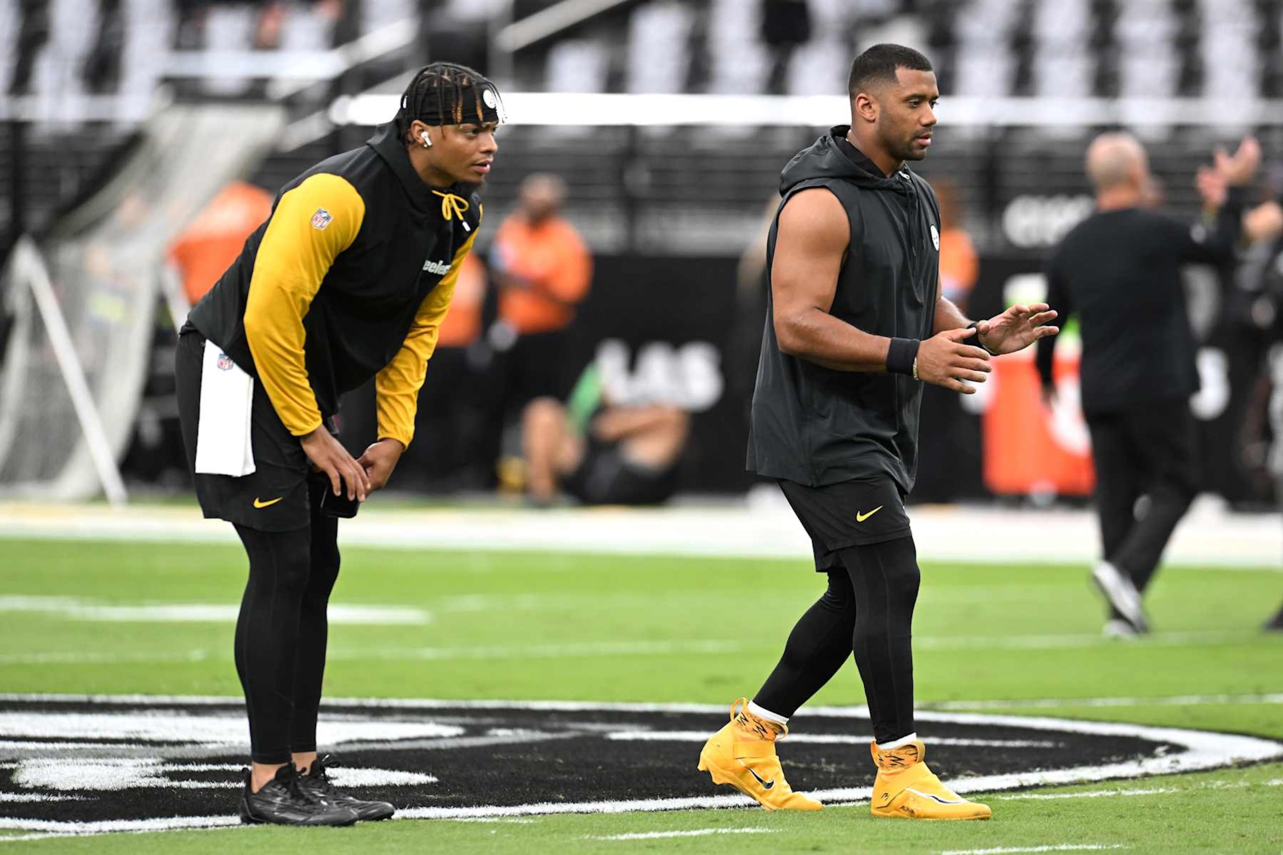 LAS VEGAS, NEVADA - OCTOBER 13: (L-R) Justin Fields #2 and Russell Wilson #3 of the Pittsburgh Steelers warm-up prior to a game against the Las Vegas Raiders at Allegiant Stadium on October 13, 2024 in Las Vegas, Nevada. (Photo by Candice Ward/Getty Images)