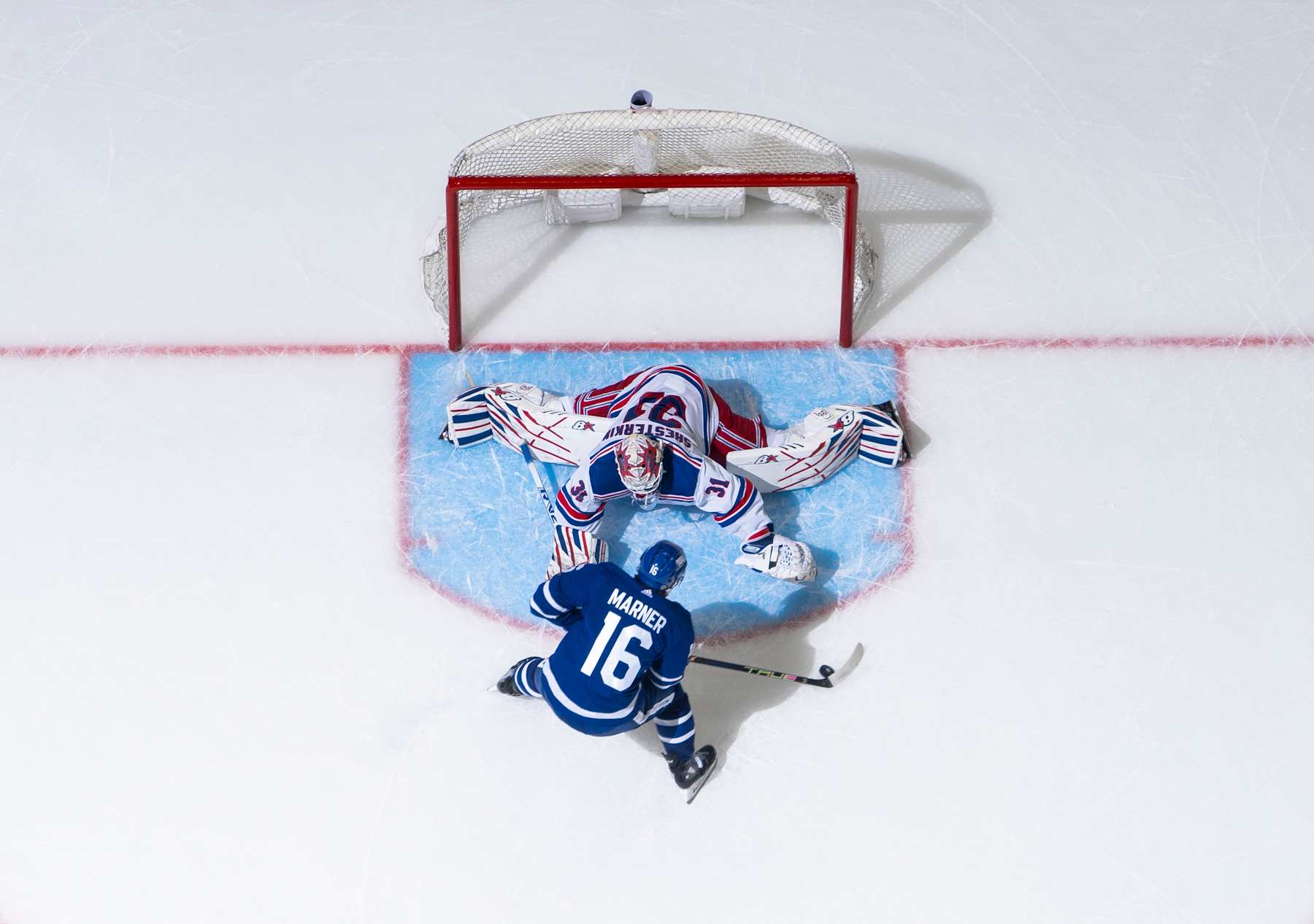 Toronto Maple Leafs winger Mitch Marner attempts to score on New York Rangers goaltender Igor Shesterkin. 