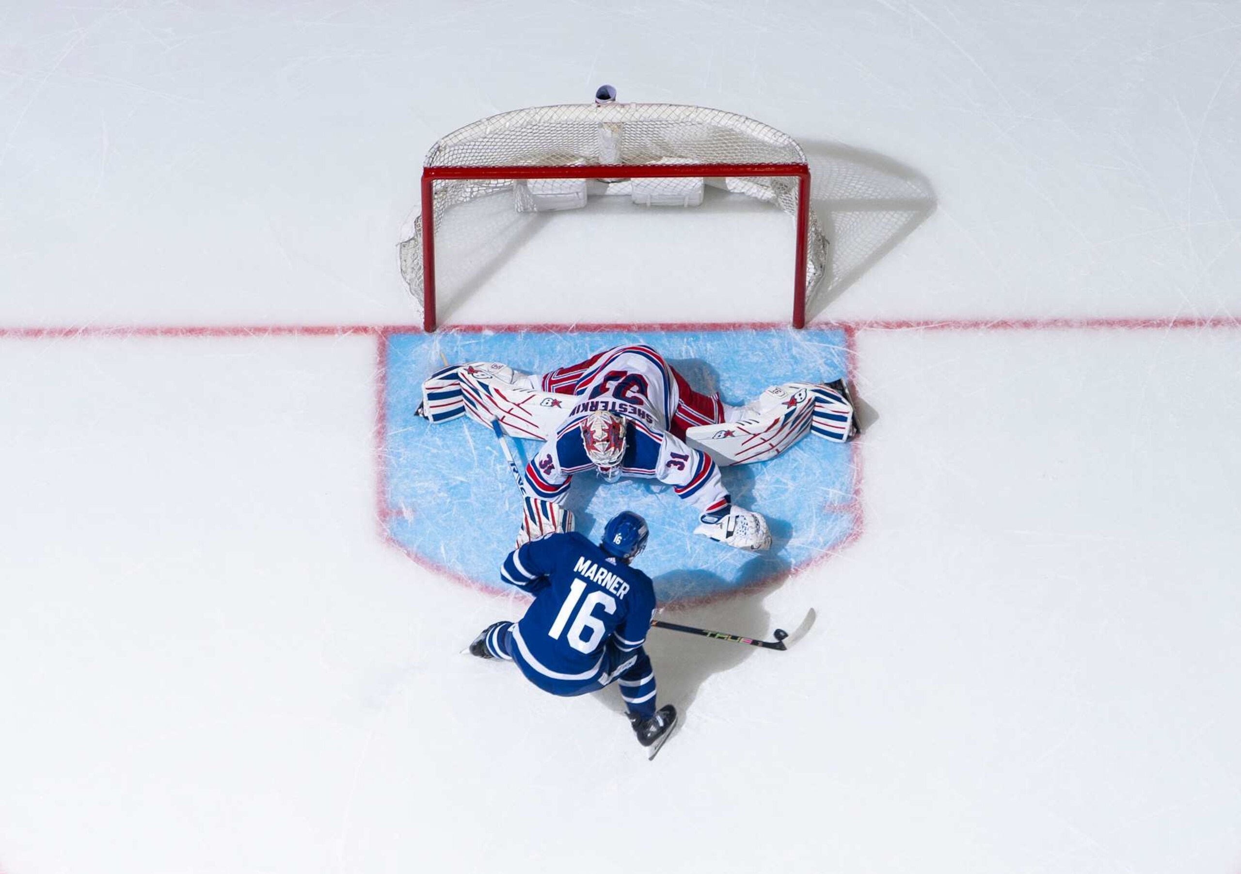 Toronto Maple Leafs winger Mitch Marner attempts to score on New York Rangers goaltender Igor Shesterkin. 