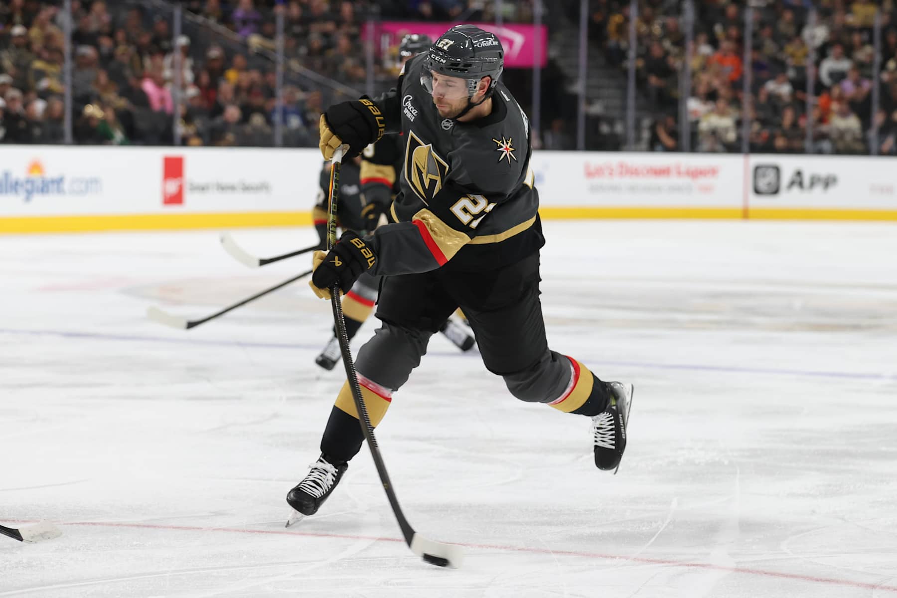 LAS VEGAS, NEVADA - OCTOBER 13: Shea Theodore #27 of the Vegas Golden Knights shoots the puck during the second period against the Anaheim Ducks at T-Mobile Arena on October 13, 2024 in Las Vegas, Nevada. (Photo by Zak Krill/NHLI via Getty Images)