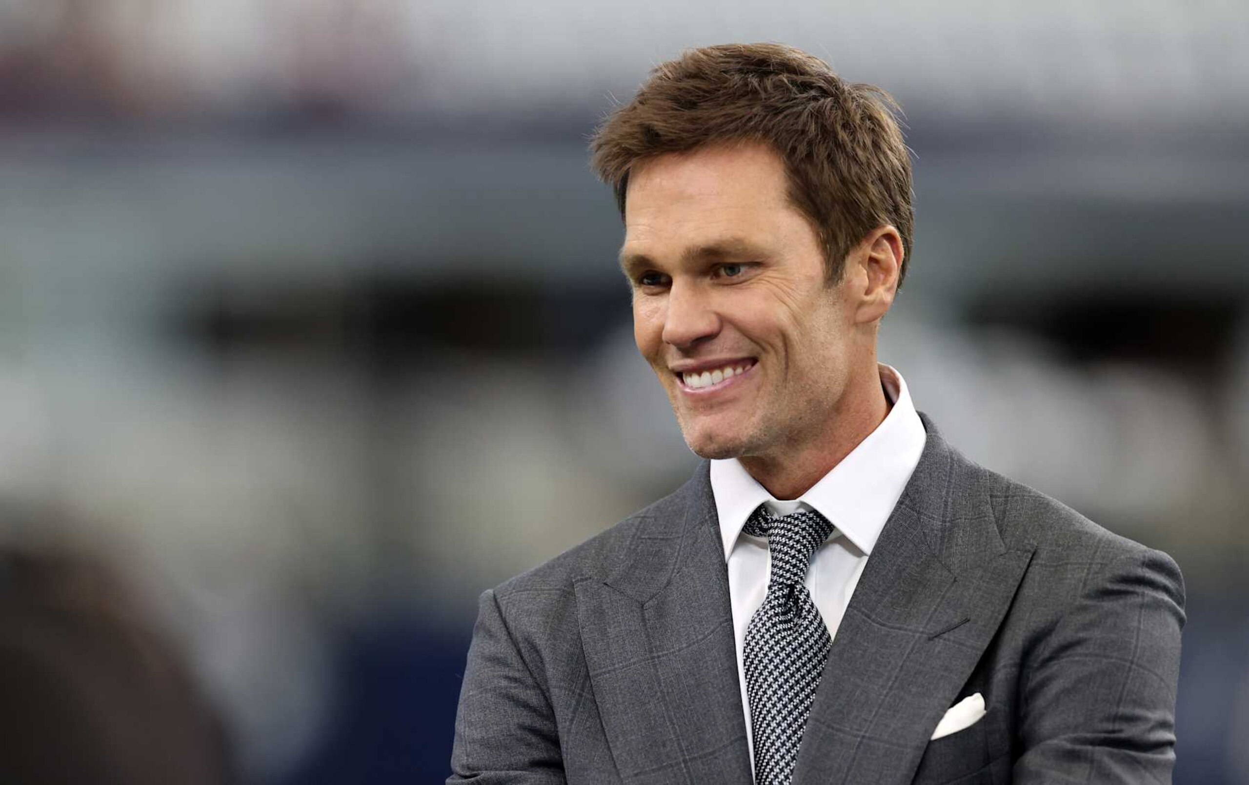 ARLINGTON, TEXAS - OCTOBER 13: Tom Brady, former NFL quarterback, looks on before the Detroit Lions play the Dallas Cowboys at AT&T Stadium on October 13, 2024 in Arlington, Texas. (Photo by Ron Jenkins/Getty Images)