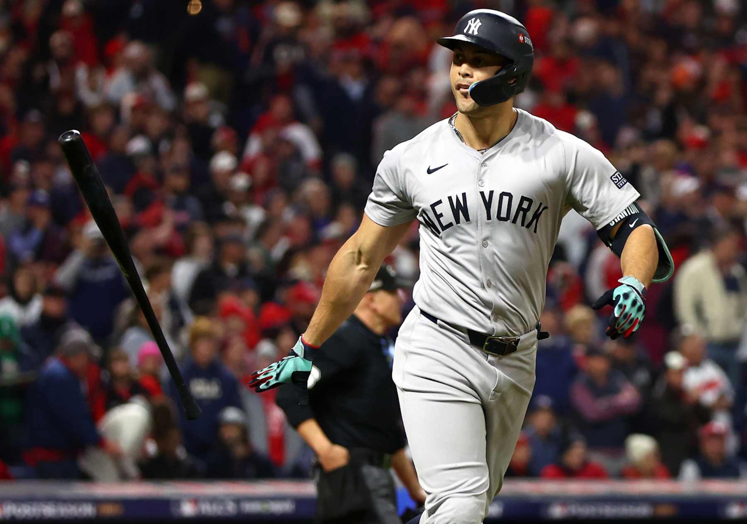 CLEVELAND, OHIO - OCTOBER 18: Giancarlo Stanton #27 of the New York Yankees reacts after hitting a three-run home run in the sixth inning against the Cleveland Guardians during Game Four of the American League Championship Series at Progressive Field on October 18, 2024 in Cleveland, Ohio. (Photo by Maddie Meyer/Getty Images)