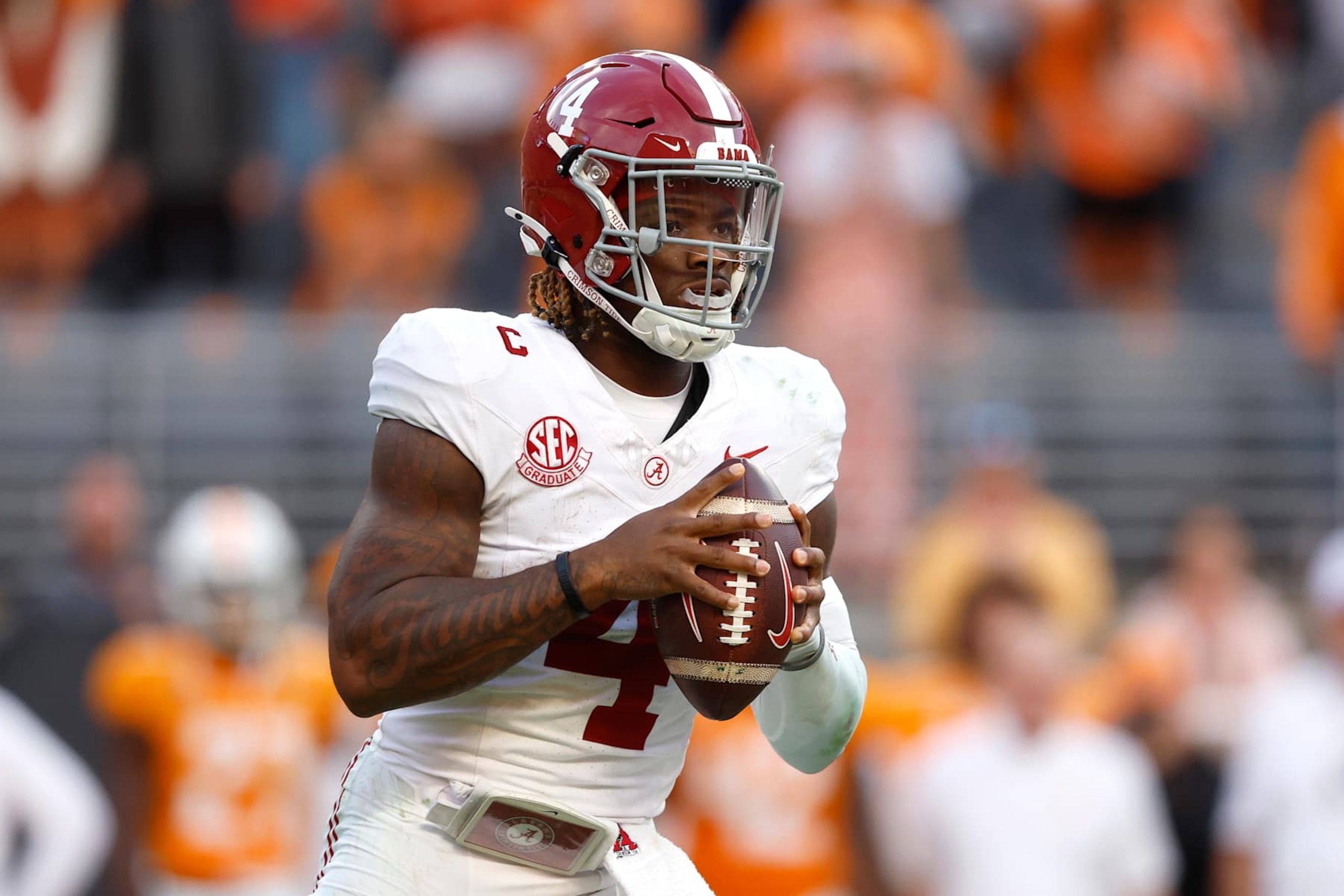 KNOXVILLE, TENNESSEE - OCTOBER 19: Jalen Milroe #4 of the Alabama Crimson Tide looks to throw the ball during the thir quarter against the Tennessee Volunteers at Nissan Stadium on October 19, 2024 in Nashville, Tennessee. (Photo by Butch Dill/Getty Images)