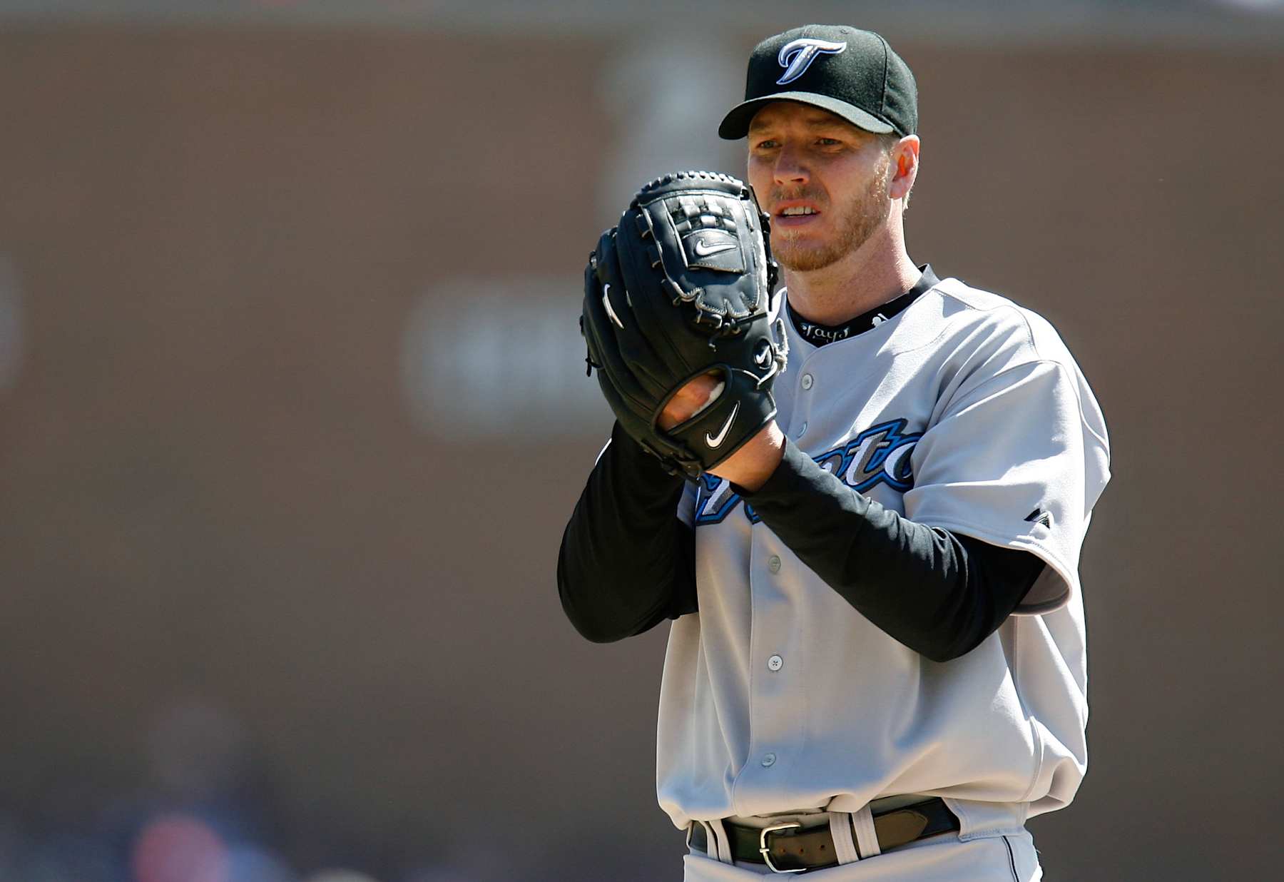DETROIT - APRIL 02:  Starting pitcher Roy Halladay #34 of the Toronto Blue Jays looks towards the catcher for a sign as he gets set to throw a pitch against the Detroit Tigers during the Home Opener for the Detroit Tigers at Comerica Park on April 2, 2007 in Detroit, Michigan  (Photo by Gregory Shamus/Getty Images)