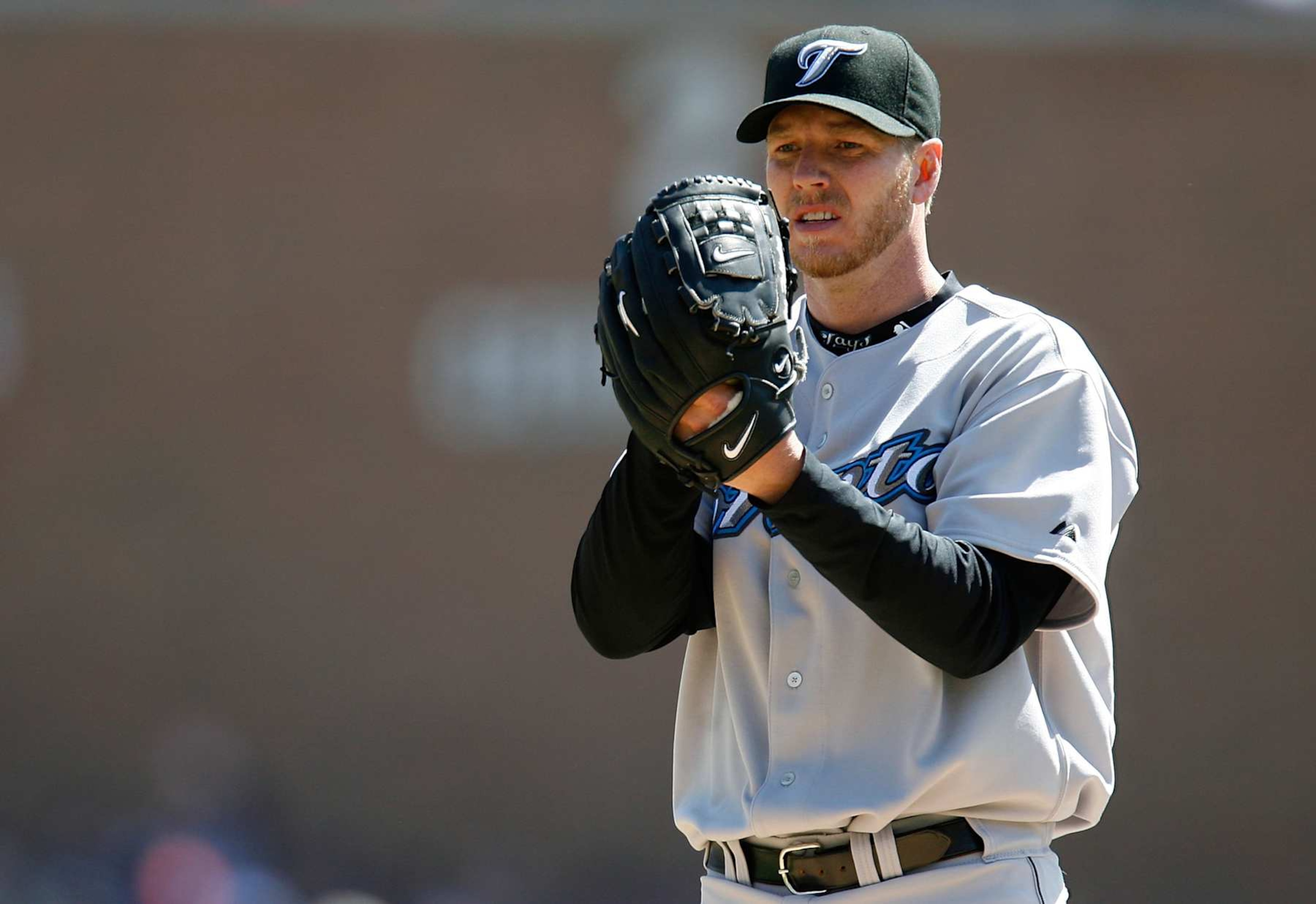DETROIT - APRIL 02: Starting pitcher Roy Halladay #34 of the Toronto Blue Jays looks towards the catcher for a sign as he gets set to throw a pitch against the Detroit Tigers during the Home Opener for the Detroit Tigers at Comerica Park on April 2, 2007 in Detroit, Michigan (Photo by Gregory Shamus/Getty Images) DETROIT - APRIL 02: Starting pitcher Roy Halladay #34 of the Toronto Blue Jays looks towards the catcher for a sign as he gets set to throw a pitch against the Detroit Tigers during the Home Opener for the Detroit Tigers at Comerica Park on April 2, 2007 in Detroit, Michigan (Photo by Gregory Shamus/Getty Images)