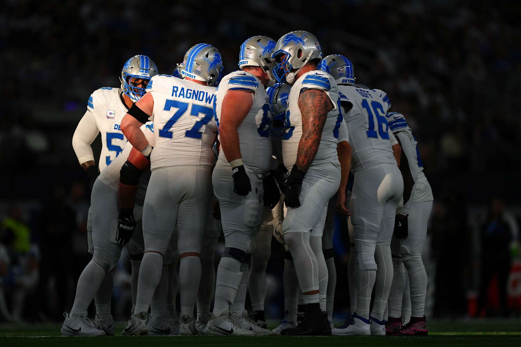 ARLINGTON, TEXAS - OCTOBER 13: The Detroit Lions offense huddles before a play in the third quarter of a game against the Dallas Cowboys at AT&T Stadium on October 13, 2024 in Arlington, Texas. (Photo by Sam Hodde/Getty Images)