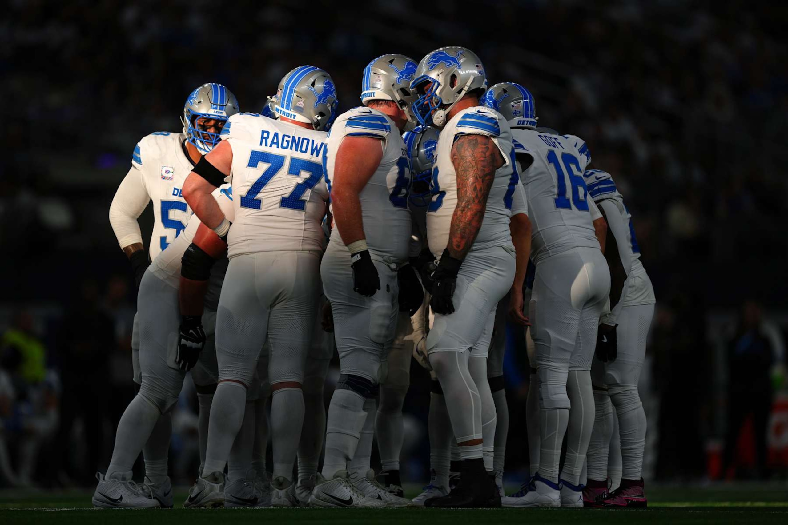 ARLINGTON, TEXAS - OCTOBER 13: The Detroit Lions offense huddles before a play in the third quarter of a game against the Dallas Cowboys at AT&T Stadium on October 13, 2024 in Arlington, Texas. (Photo by Sam Hodde/Getty Images) ARLINGTON, TEXAS - OCTOBER 13: The Detroit Lions offense huddles before a play in the third quarter of a game against the Dallas Cowboys at AT&T Stadium on October 13, 2024 in Arlington, Texas. (Photo by Sam Hodde/Getty Images)