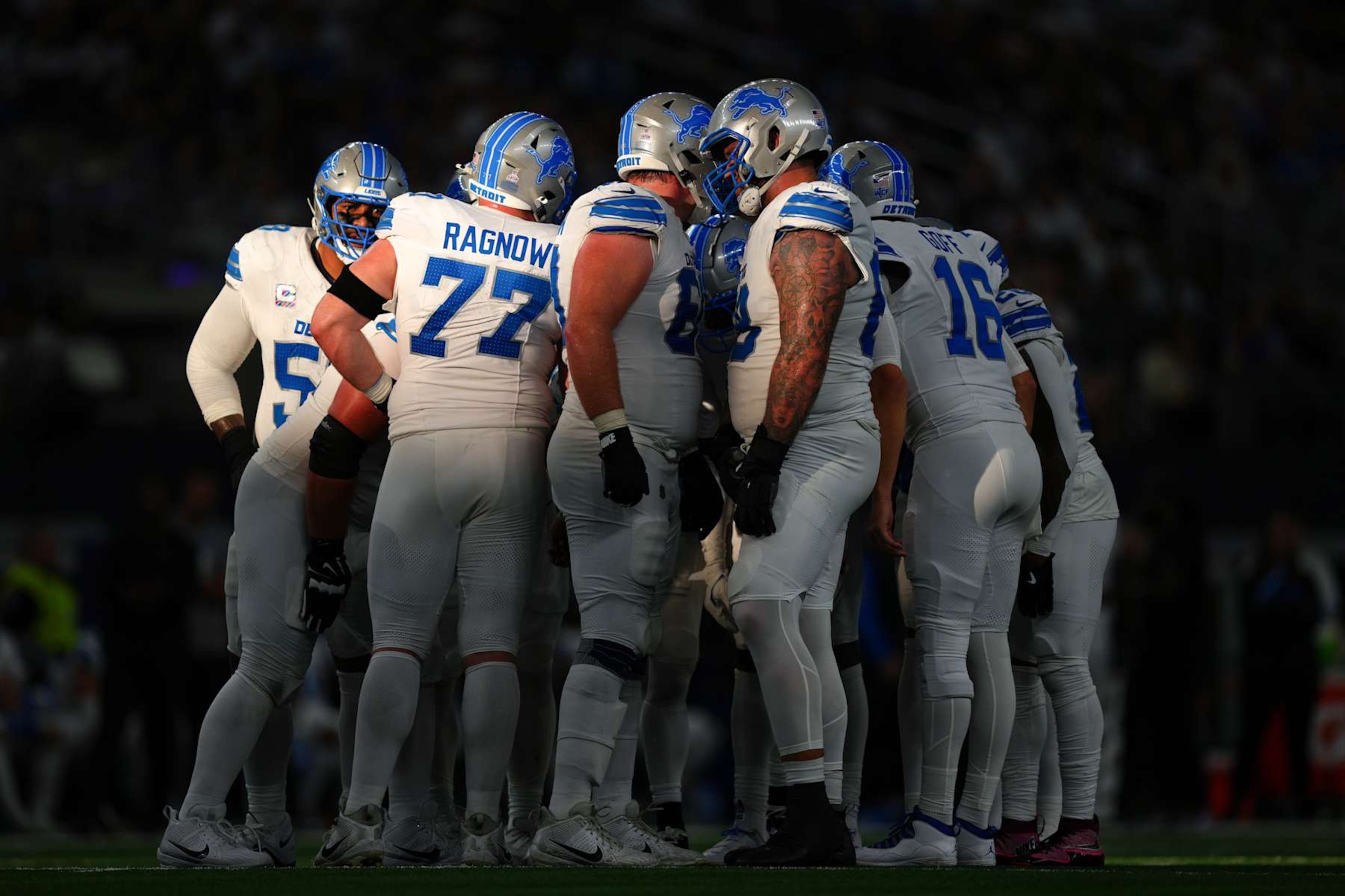 ARLINGTON, TEXAS - OCTOBER 13: The Detroit Lions offense huddles before a play in the third quarter of a game against the Dallas Cowboys at AT&T Stadium on October 13, 2024 in Arlington, Texas. (Photo by Sam Hodde/Getty Images) ARLINGTON, TEXAS - OCTOBER 13: The Detroit Lions offense huddles before a play in the third quarter of a game against the Dallas Cowboys at AT&T Stadium on October 13, 2024 in Arlington, Texas. (Photo by Sam Hodde/Getty Images)
