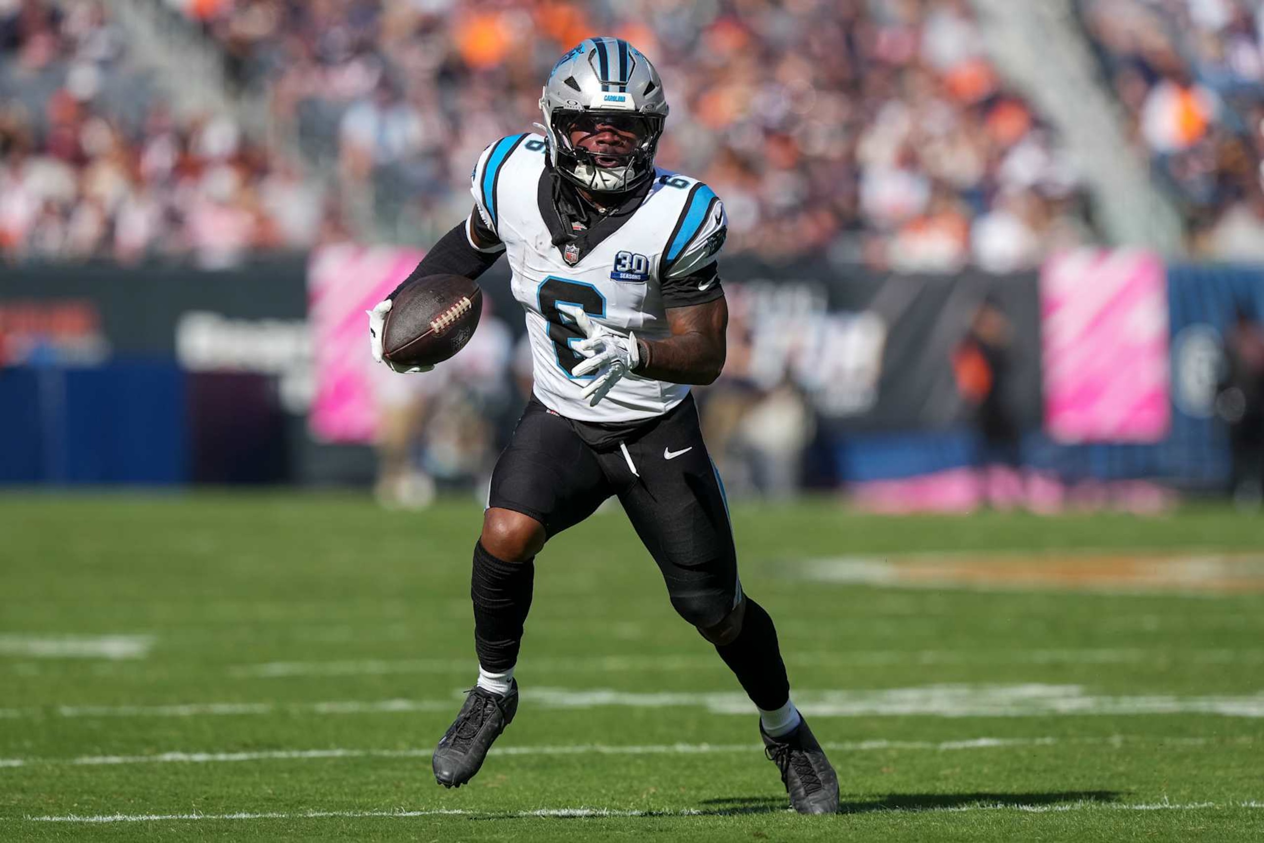 CHICAGO, ILLINOIS - OCTOBER 6: Running back Miles Sanders #6 of the Carolina Panthers carries the ball during the fourth quarter of an NFL football game against the Chicago Bears, at Soldier Field on October 6, 2024 in Chicago, Illinois. (Photo by Todd Rosenberg/Getty Images)
